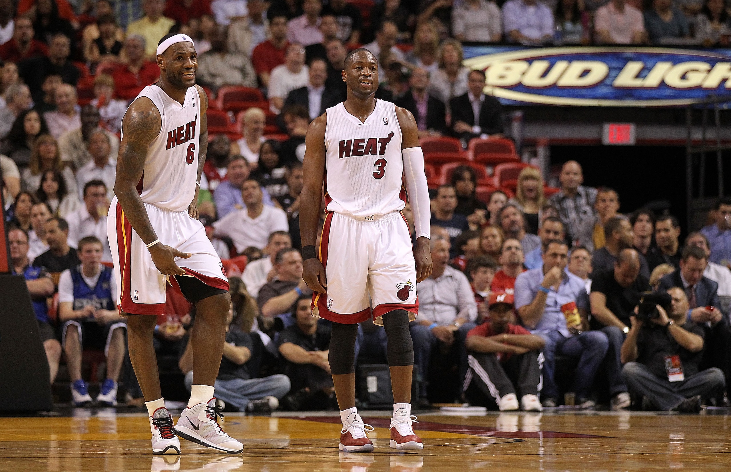 MIAMI, FL - FEBRUARY 22:  Dwyane Wade #3 and LeBron James #6 of the Miami Heat talk during a foul shot during a game against the Sacramento Kings at American Airlines Arena on February 22, 2011 in Miami, Florida. NOTE TO USER: User expressly acknowledges
