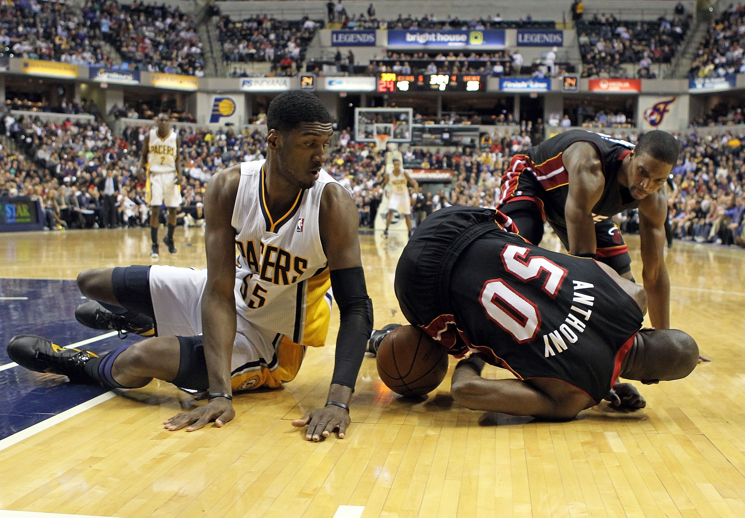 INDIANAPOLIS - FEBRUARY 15: Joel Anthony #50 of the Miami Heat and Roy Hibbert #55 of the Indiana Pacers battle for a loose ball during the NBA game at Conseco Fieldhouse on February 15, 2011 in Indianapolis, Indiana.   The Heat won 110-103.   NOTE TO USE