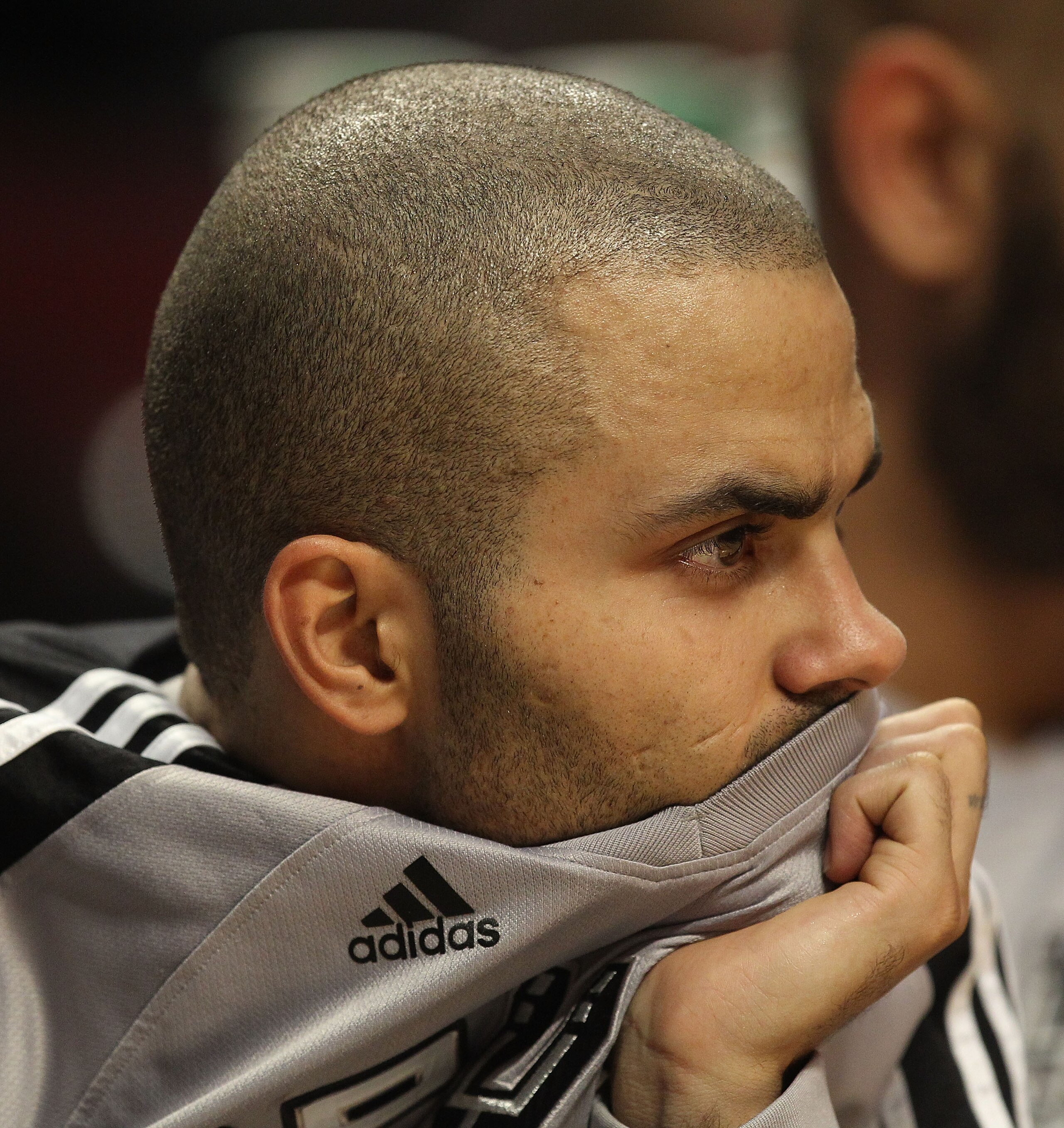 CHICAGO, IL - FEBRUARY 17: Tony Parker #9 of the San Antonio Spurs sits on the bench watching his teammates take on the Chicago Bulls at the United Center on February 17, 2011 in Chicago, Illinois. The Bulls defeated the Spurs 109-99. NOTE TO USER: User e