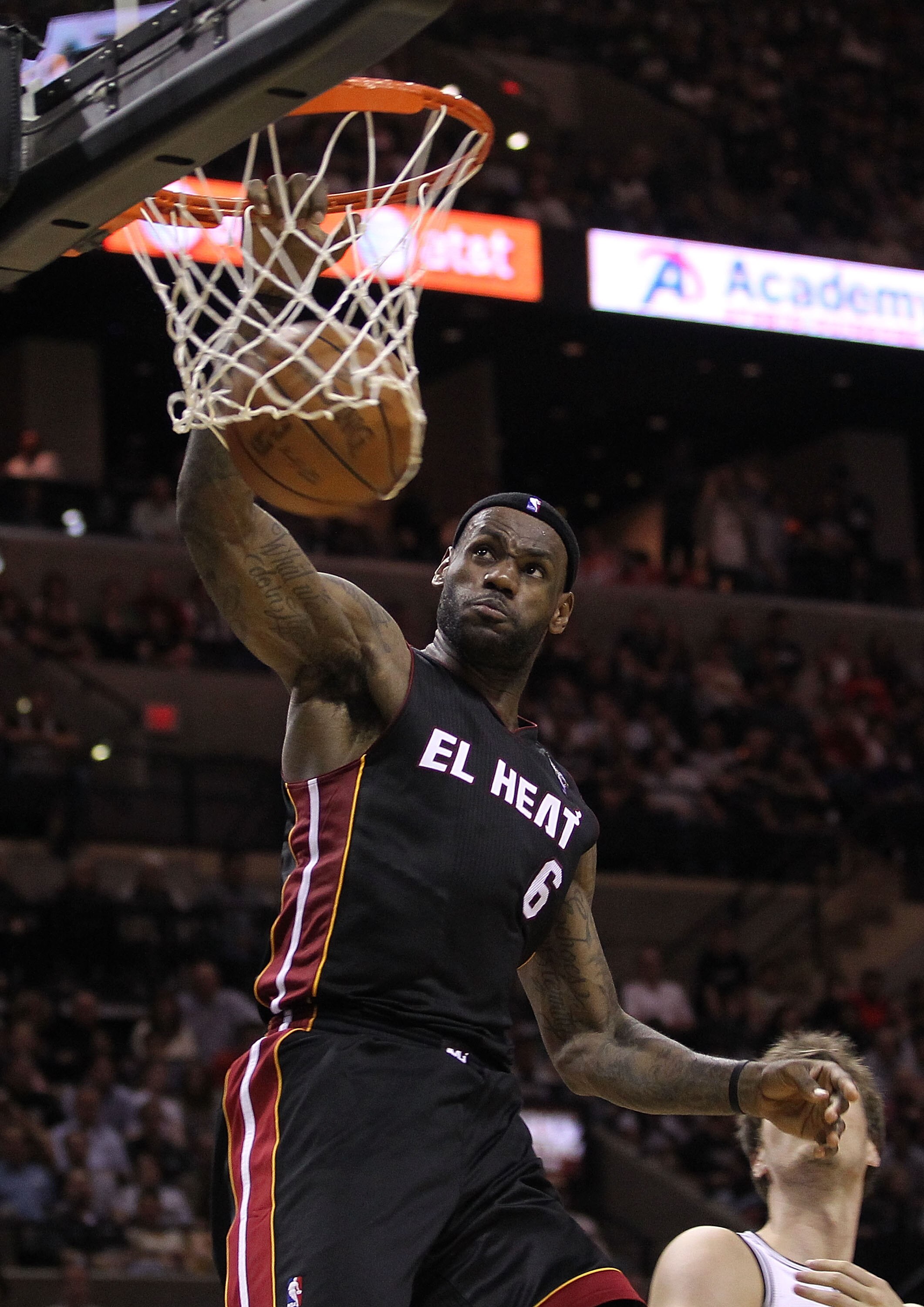 SAN ANTONIO, TX - MARCH 04:  LeBron James #6 of the Miami Heat gets the slam dunk against the San Antonio Spurs at AT&T Center on March 4, 2011 in San Antonio, Texas.   NOTE TO USER: User expressly acknowledges and agrees that, by downloading and or using