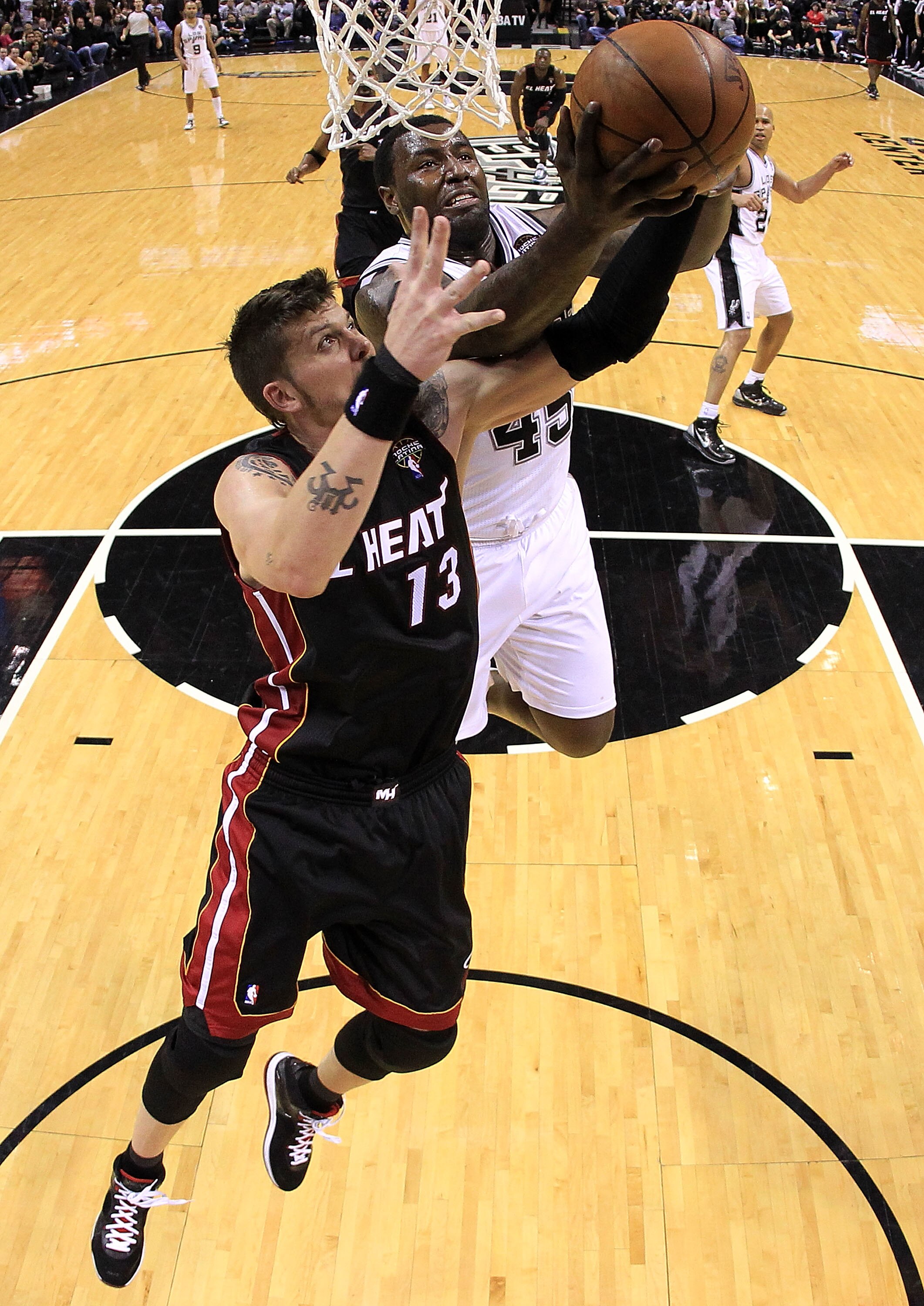 SAN ANTONIO, TX - MARCH 04:  Forward DeJuan Blair #45 of the San Antonio Spurs takes a shot against Mike Miller #13 of the Miami Heat at AT&T Center on March 4, 2011 in San Antonio, Texas.   NOTE TO USER: User expressly acknowledges and agrees that, by do