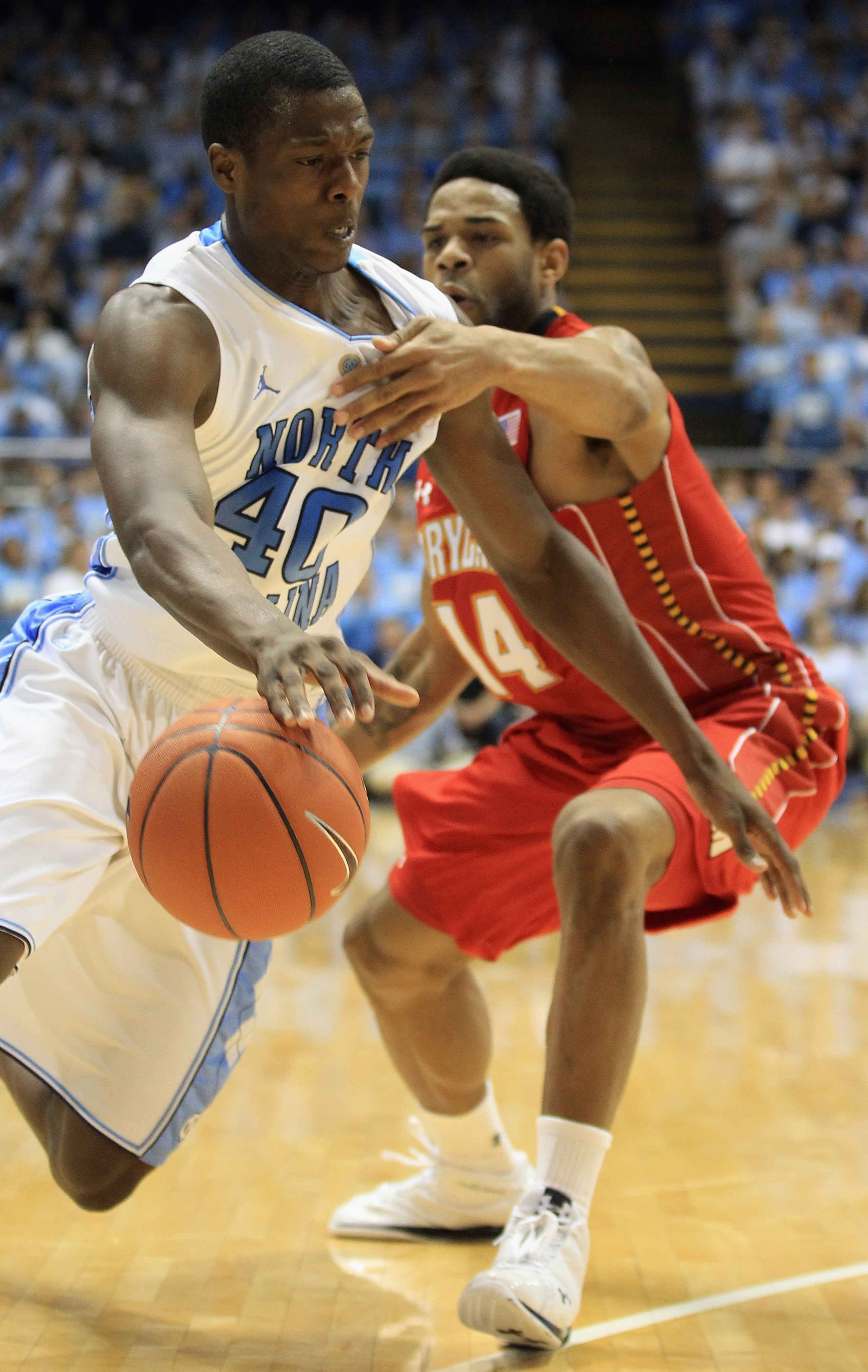 CHAPEL HILL, NC - FEBRUARY 27: Sean Mosley #14 of the Maryland Terrapins fouls Harrison Barnes #40 of the North Carolina Tar Heels on his drive to the basket during their game at the Dean E. Smith Center on February 27, 2011 in Chapel Hill, North Carolin CHAPEL HILL, NC - FEBRUARY 27: Sean Mosley #14 of the Maryland Terrapins fouls Harrison Barnes #40 of the North Carolina Tar Heels on his drive to the basket during their game at the Dean E. Smith Center on February 27, 2011 in Chapel Hill, North Carolin