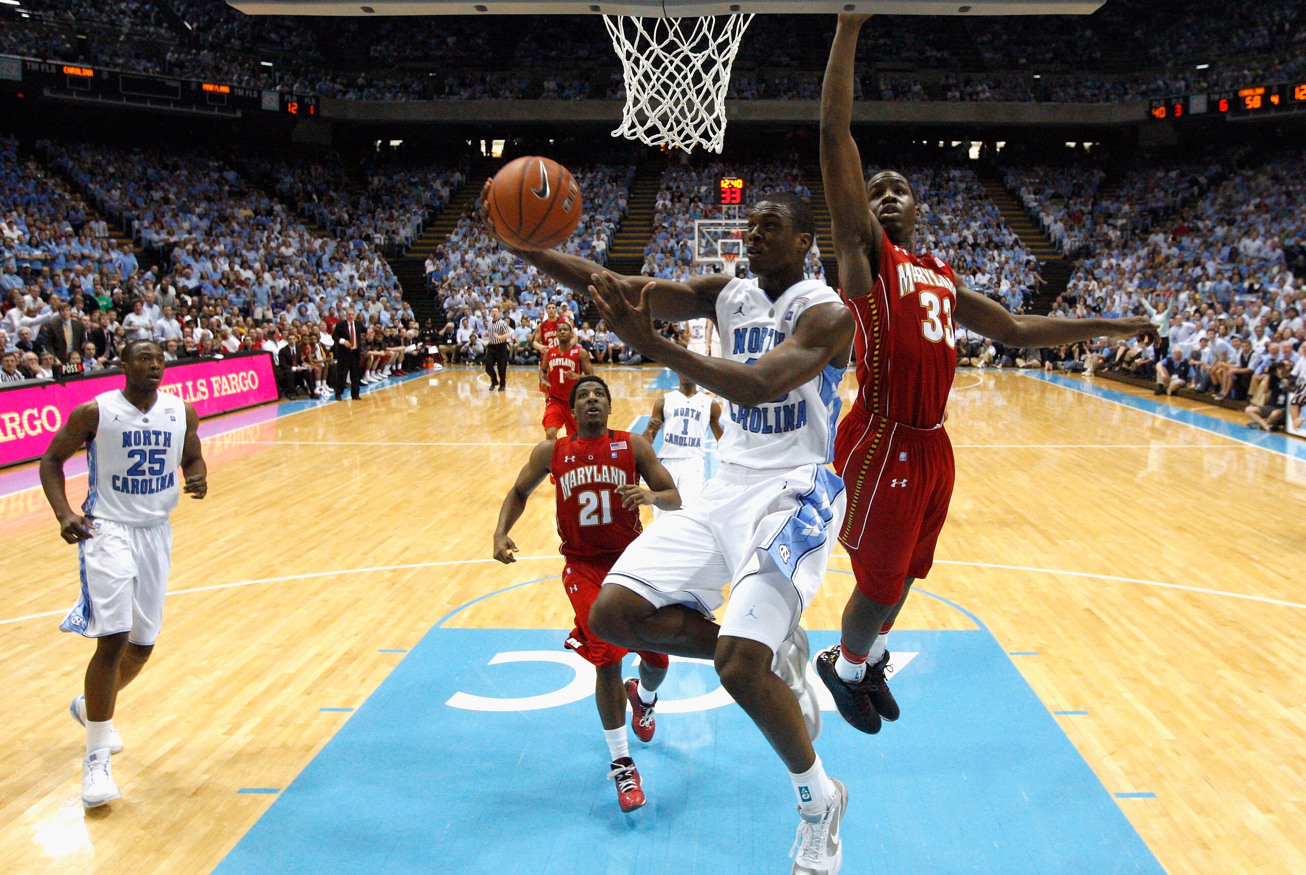 CHAPEL HILL, NC - FEBRUARY 27: Harrison Barnes #40 of the North Carolina Tar Heels drives to the basket on Dino Gregory #33 of the Maryland Terrapins during their game at the Dean E. Smith Center on February 27, 2011 in Chapel Hill, North Carolina. (Pho CHAPEL HILL, NC - FEBRUARY 27: Harrison Barnes #40 of the North Carolina Tar Heels drives to the basket on Dino Gregory #33 of the Maryland Terrapins during their game at the Dean E. Smith Center on February 27, 2011 in Chapel Hill, North Carolina. (Pho