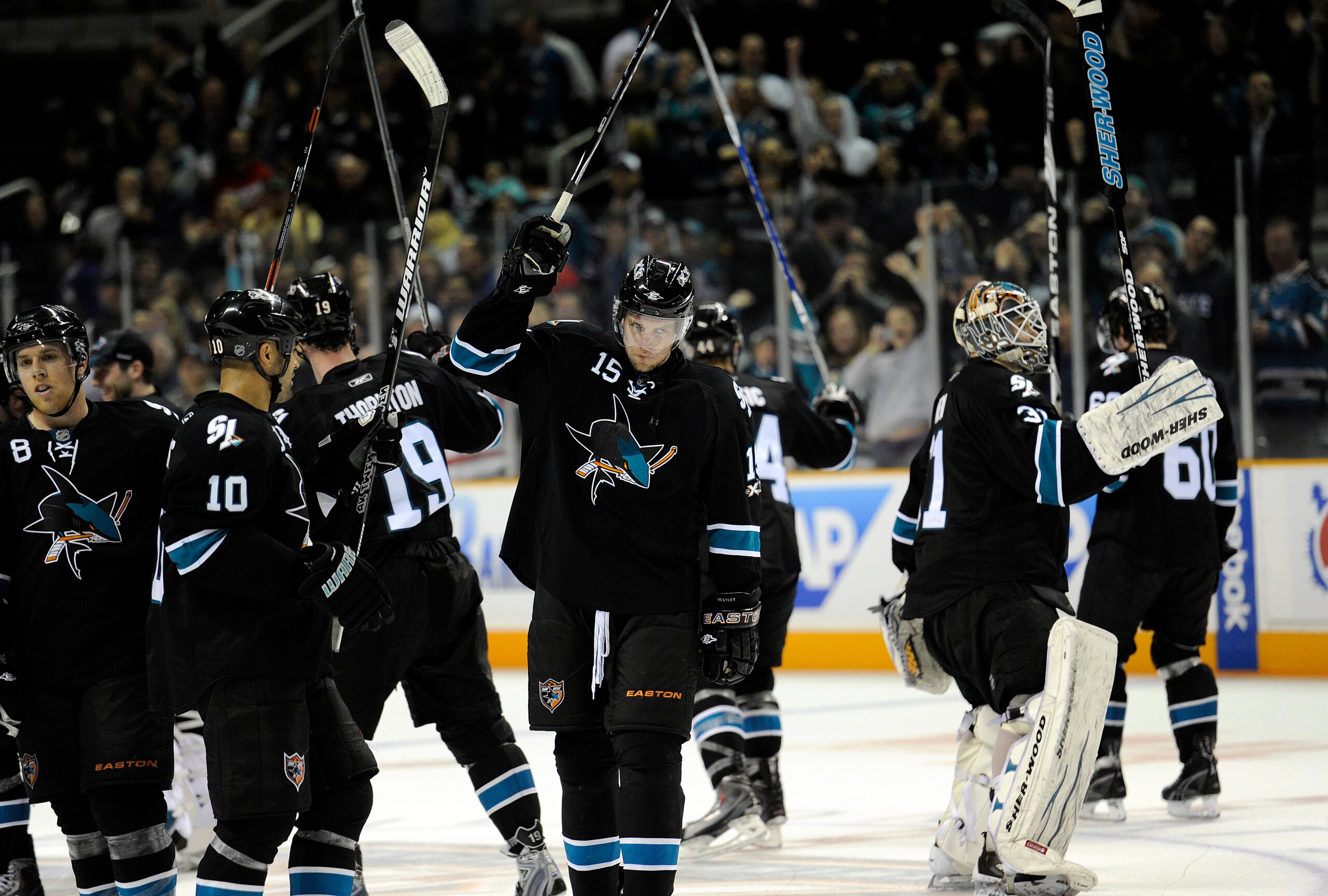 SAN JOSE, CA - MARCH 3: Dany Heatley #15 and his teammates of the San Jose Sharks salute the crowd after the Sharks defeated the Detroit Red Wings 3-1 in an NHL hockey game at the HP Pavilion on March 3, 2011 in San Jose, California. (Photo by Thearon W.