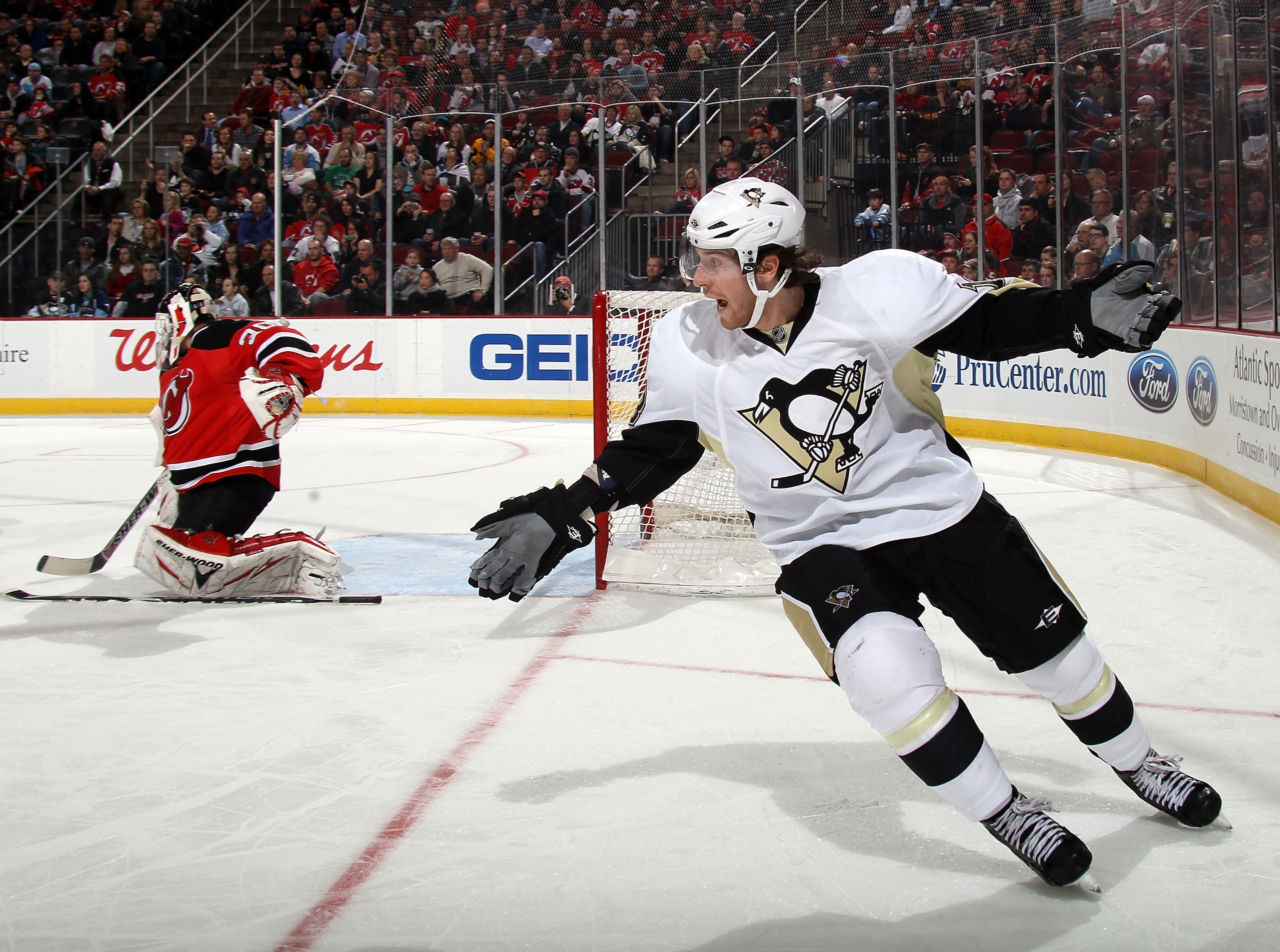 NEWARK, NJ - MARCH 04: James Neal #18 of the Pittsburgh Penguins argues with the ref after his stick is knocked out of his hands against the New Jersey Devils at the Prudential Center on March 4, 2011 in Newark, New Jersey. The Devils defeated the Penguin