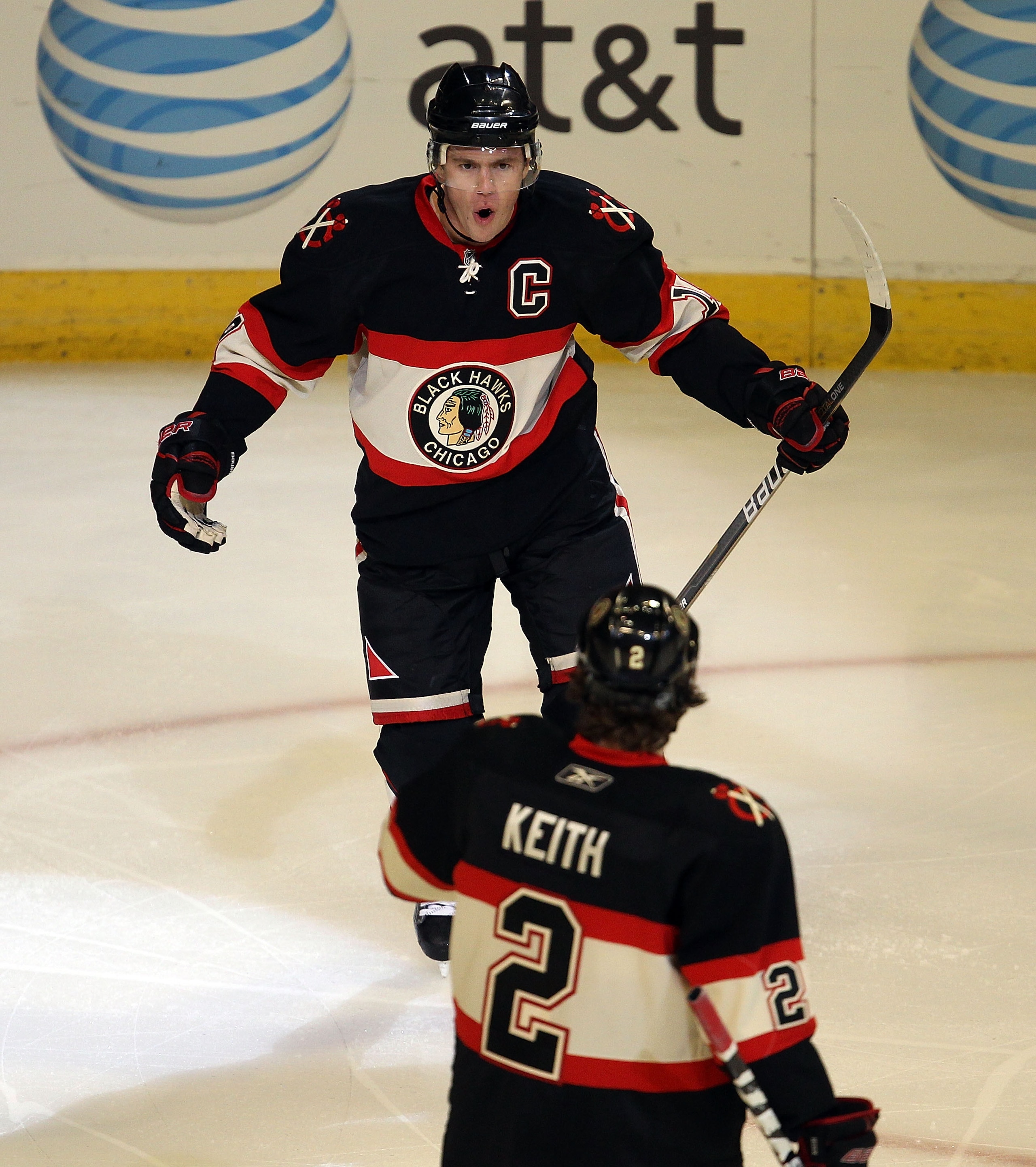 CHICAGO, IL - MARCH 04: Jonathan Toews #19 of the Chicago Blackhawks celebrates his goal scored 55 seconds into the game against the Carolina Hurricanes with teammate Duncan Keith #2 at the United Center on March 4, 2011 in Chicago, Illinois. (Photo by Jo