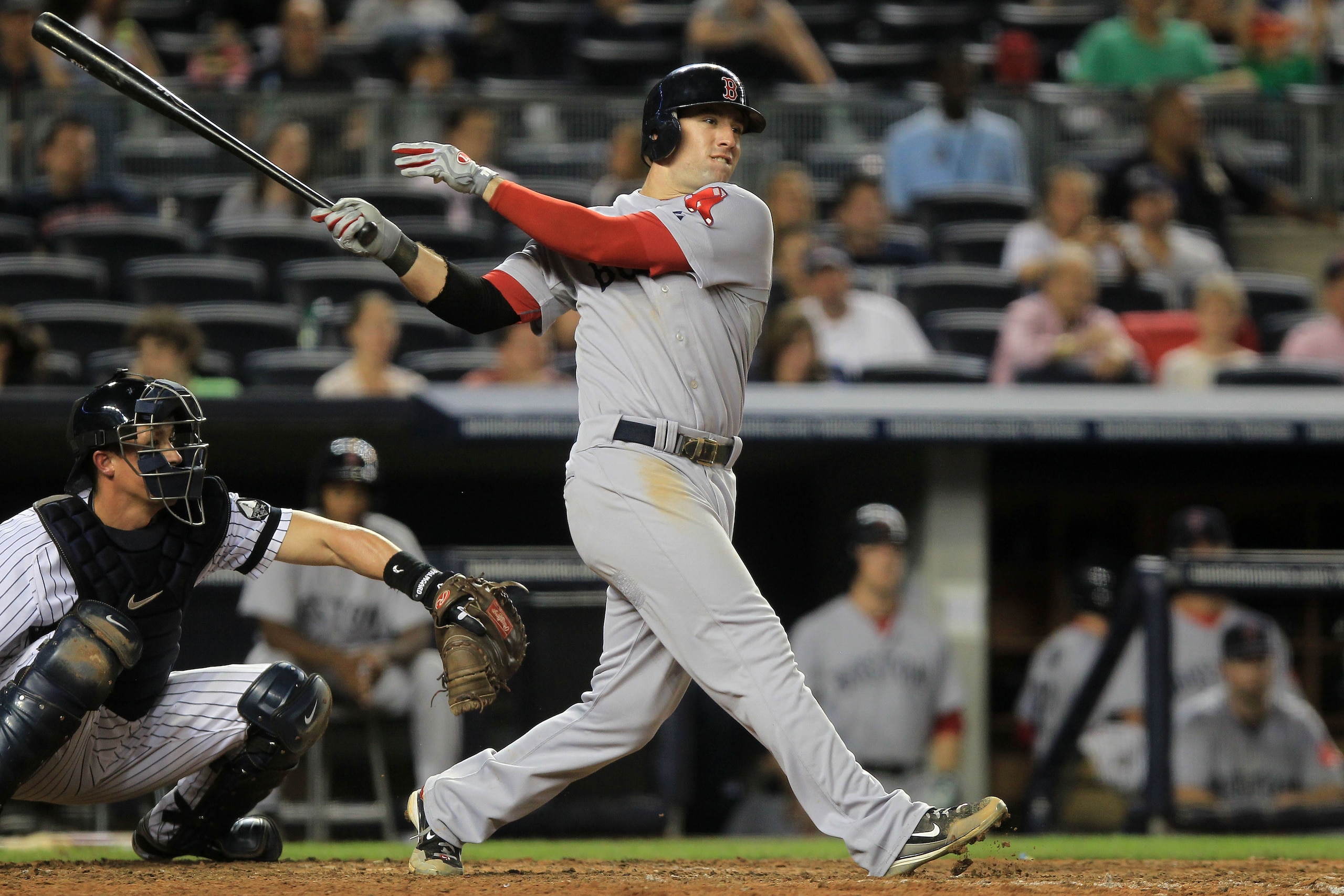 NEW YORK - SEPTEMBER 25: Ryan Kalish #55 of the Boston Red Sox hits a double to get team mate Yamaico Navarro #56 home against the New York Yankees during their game on September 25, 2010 at Yankee Stadium in the Bronx borough of New York City.  (Photo by