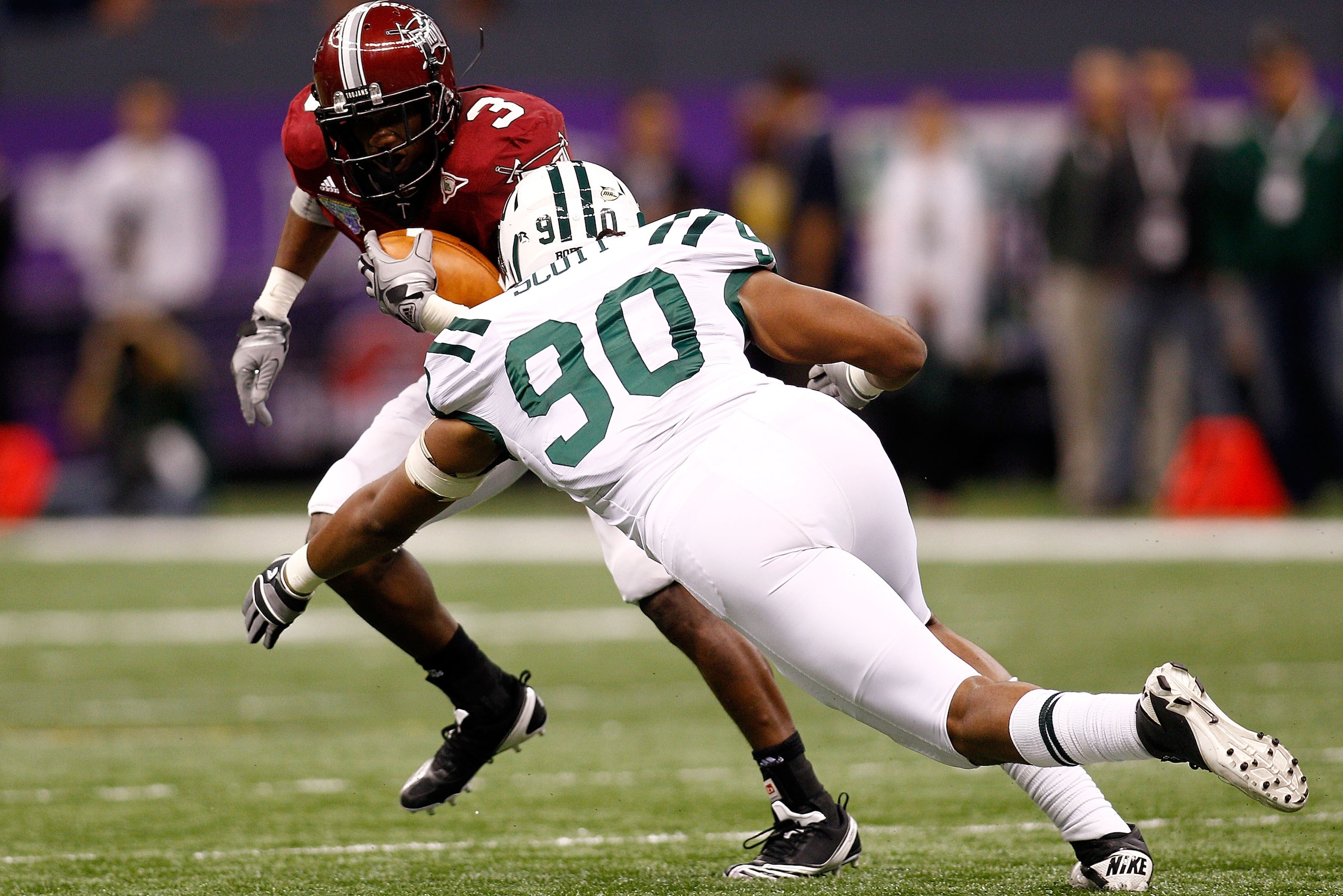NEW ORLEANS, LA - DECEMBER 18: Jerrel Jernigan #3 of the Troy University Trojans tries to avoid a tackle by Tremayne Scott #90 of the Ohio University Bobcats during the R&L Carriers New Orleans Bowl at the Louisiana Superdome on December 18, 2010 in New NEW ORLEANS, LA - DECEMBER 18: Jerrel Jernigan #3 of the Troy University Trojans tries to avoid a tackle by Tremayne Scott #90 of the Ohio University Bobcats during the R&L Carriers New Orleans Bowl at the Louisiana Superdome on December 18, 2010 in New