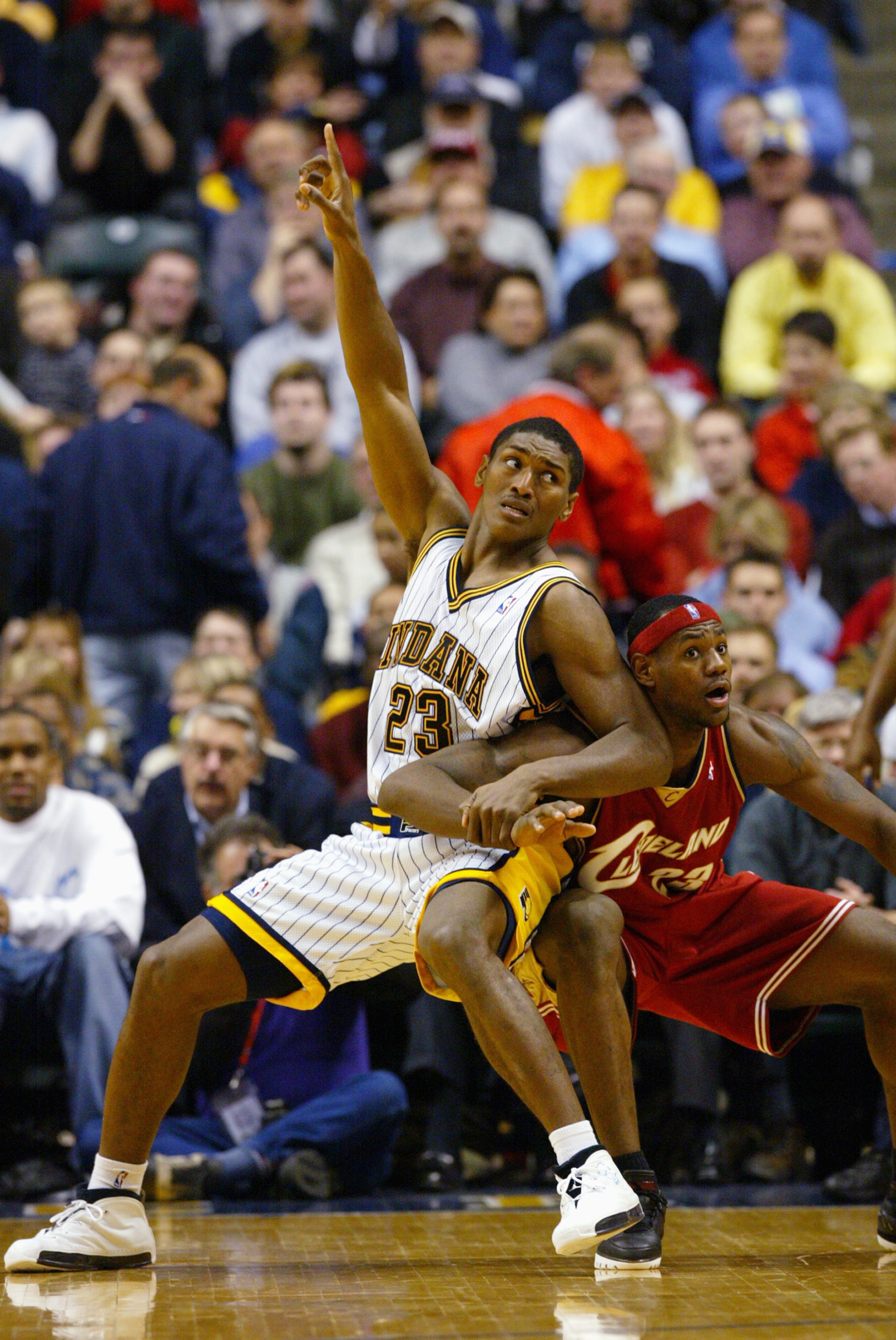 INDIANAPOLIS - DECEMBER 15:  Ron Artest #23 of the Indiana Pacers posts up LeBron James #23 of the Cleveland Cavaliers during the game at Conseco Fieldhouse on December 15, 2003 in Indianapolis, Indiana.  The Pacers won 95-85.  NOTE TO USER: User expressl