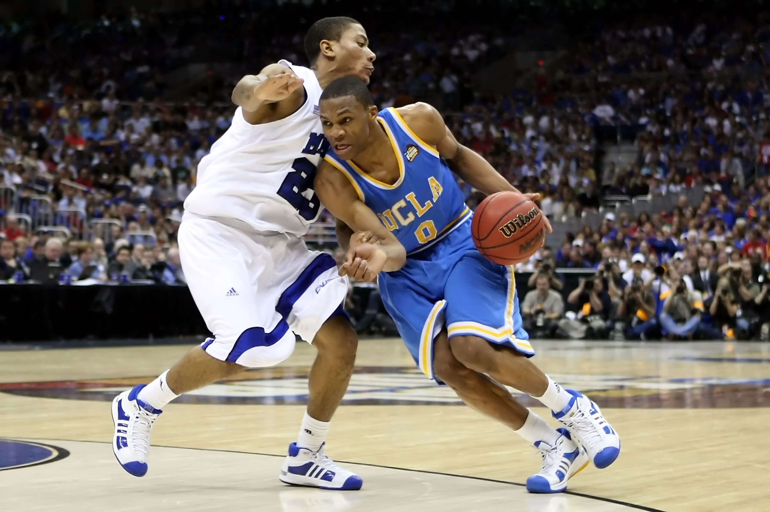 SAN ANTONIO - APRIL 05:  Russell Westbrook #0 of the UCLA Bruins drives against Derrick Rose #23 of the Memphis Tigers in the second half during the National Semifinal game of the NCAA Men's Final Four at the Alamodome on April 5, 2008 in San Antonio, Tex