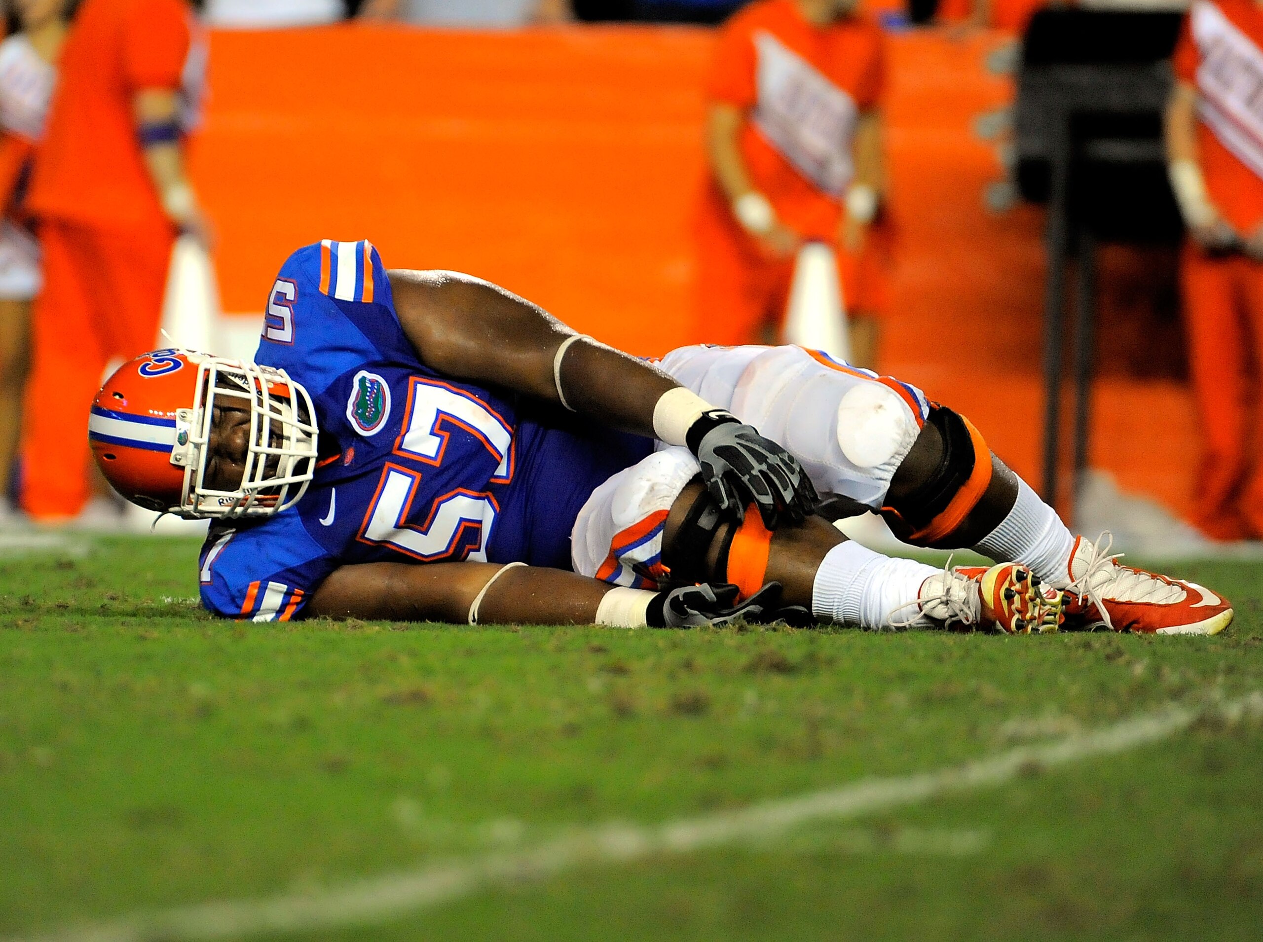 GAINESVILLE, FL - SEPTEMBER 25: Offensive lineman Carl Johnson #57 of the Florida Gators reaches for his injured ankle while taking on the Kentucky Wildcats at Ben Hill Griffin Stadium on September 25, 2010 in Gainesville, Florida. (Photo by Doug Benc/G GAINESVILLE, FL - SEPTEMBER 25: Offensive lineman Carl Johnson #57 of the Florida Gators reaches for his injured ankle while taking on the Kentucky Wildcats at Ben Hill Griffin Stadium on September 25, 2010 in Gainesville, Florida. (Photo by Doug Benc/G