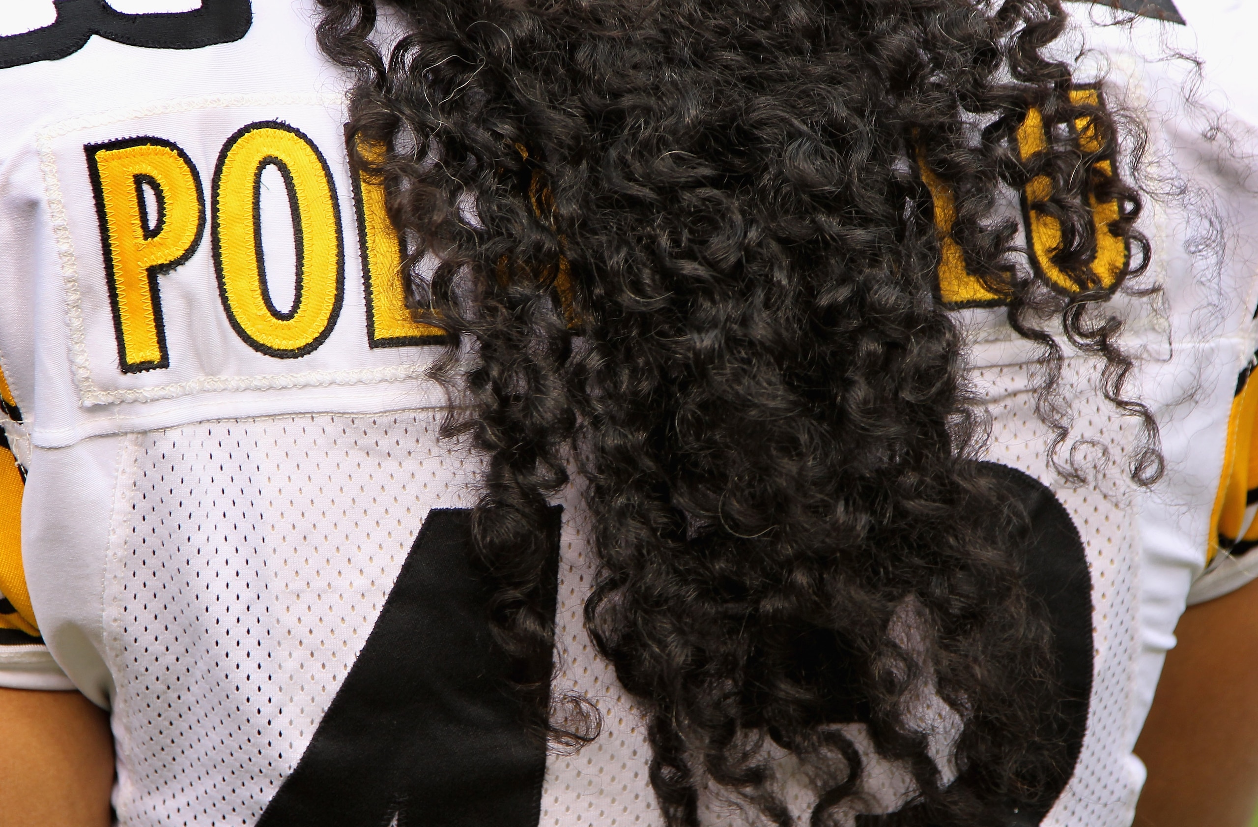 DENVER - AUGUST 29: The name on the back of the jersey of safety Troy Polamalu #43 of the Pittsburgh Steelers is obscured by his hair as he defends against the Denver Broncos during preseason NFL action at INVESCO Field at Mile High on August 29, 2010 in DENVER - AUGUST 29: The name on the back of the jersey of safety Troy Polamalu #43 of the Pittsburgh Steelers is obscured by his hair as he defends against the Denver Broncos during preseason NFL action at INVESCO Field at Mile High on August 29, 2010 in