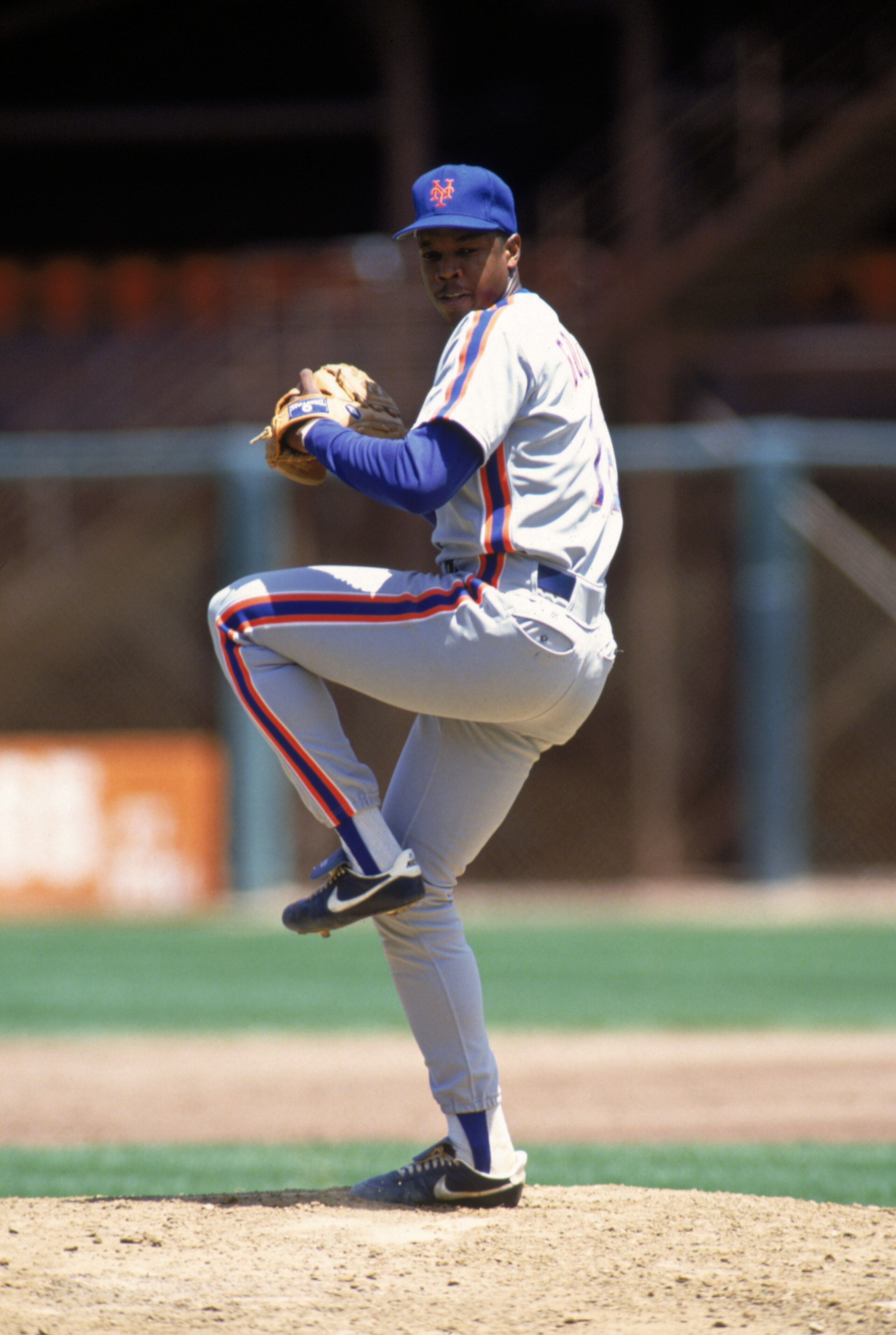 1990: Dwight Gooden of the New York Mets winds back to pitch during a game in the 1990 season. ( Photo by: Otto Greule Jr/Getty Images)