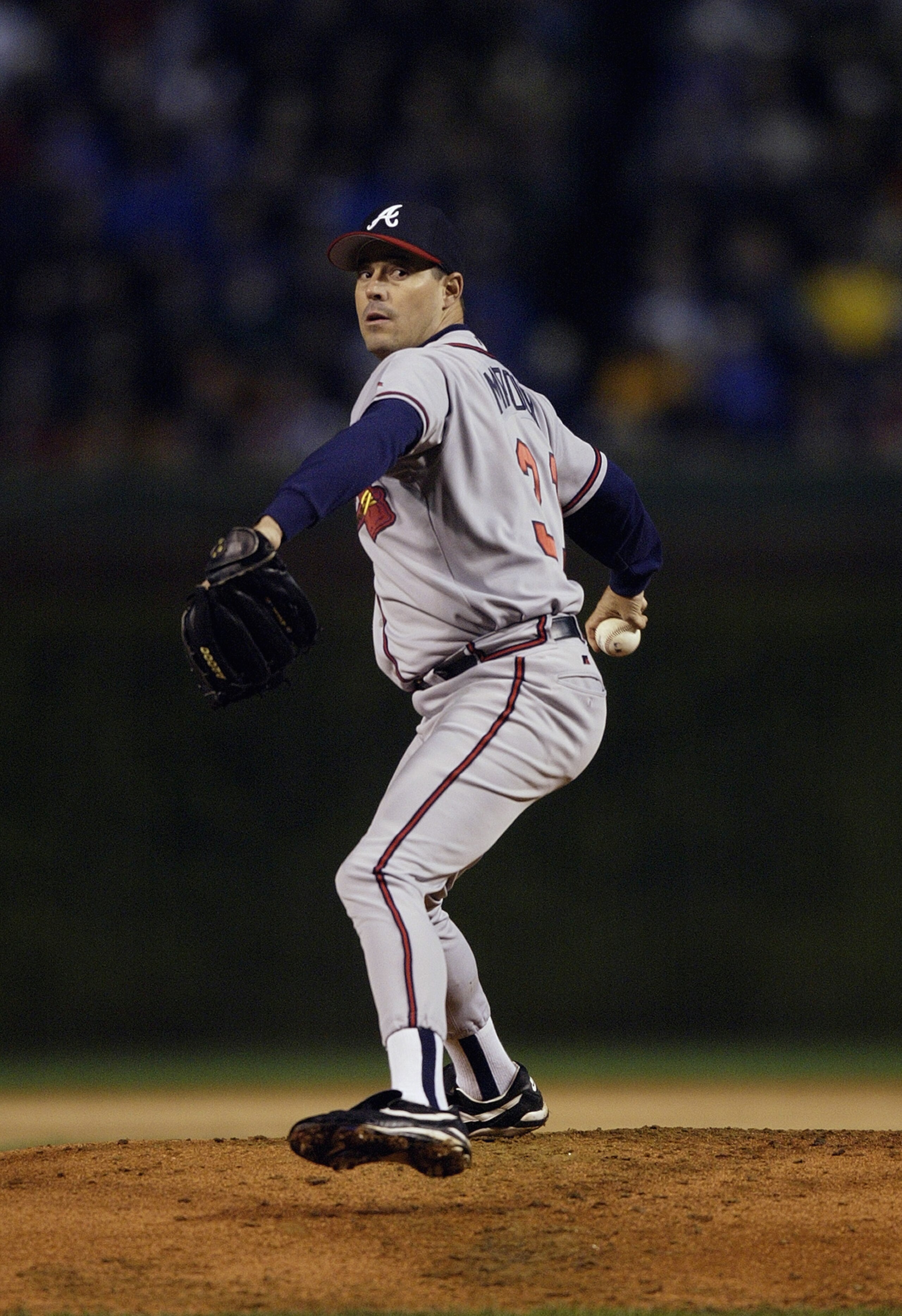 CHICAGO - OCTOBER 3:  Greg Maddux #31 of the Atlanta Braves throws against the Chicago Cubs during game three of the National League Division Series on October 3, 2003 at Wrigley Field in Chicago, Illinois.  The Cubs defeated the Braves 3-1.  (Photo by Ma