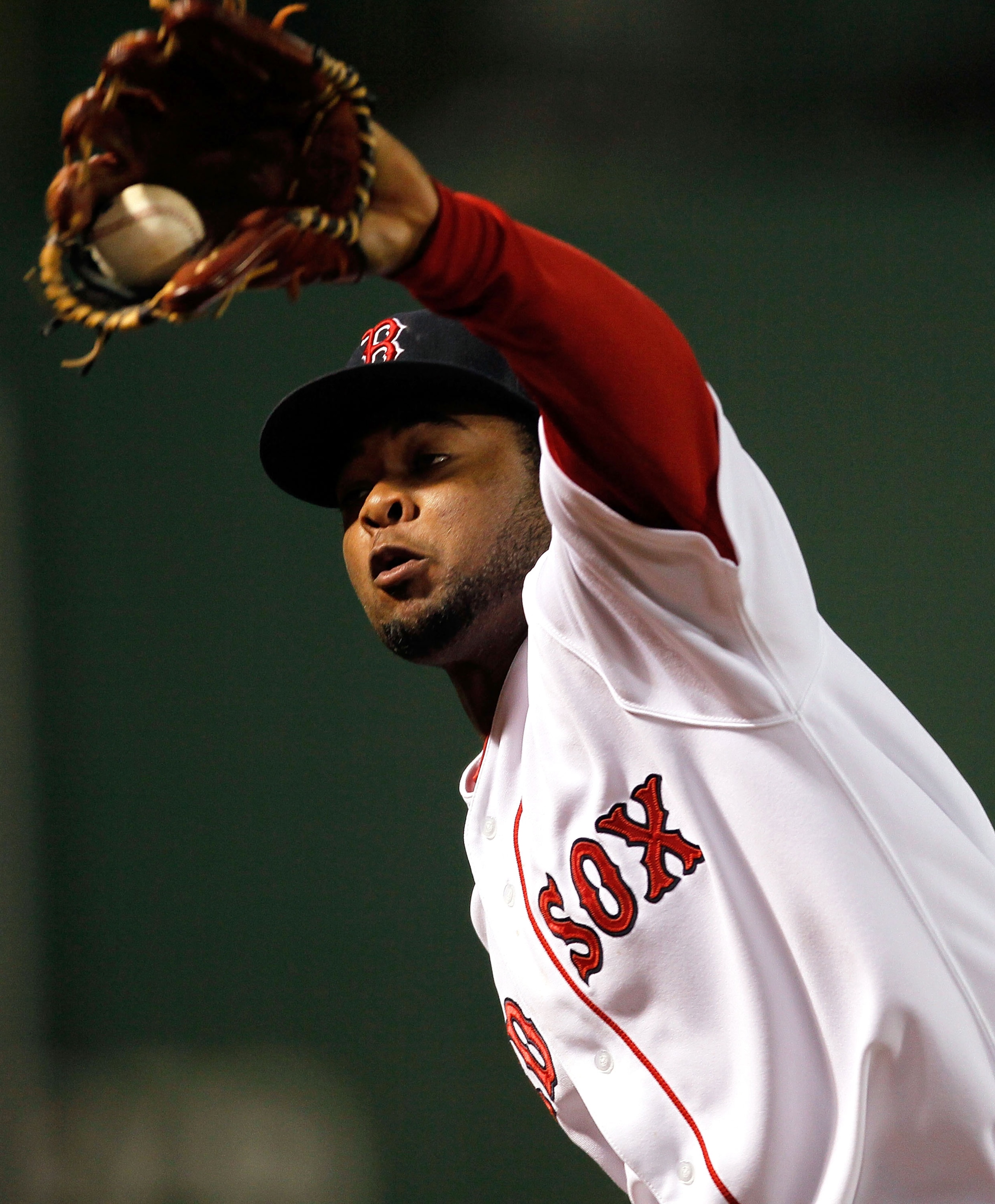BOSTON - OCTOBER 2:  Yamaico Navarro #56 of the Boston Red Sox catches a line drive of Marcus Thames #38 of the New York Yankees during the second game of a doubleheader at Fenway Park, October 2, 2010, in Boston, Massachusetts. (Photo by Jim Rogash/Getty