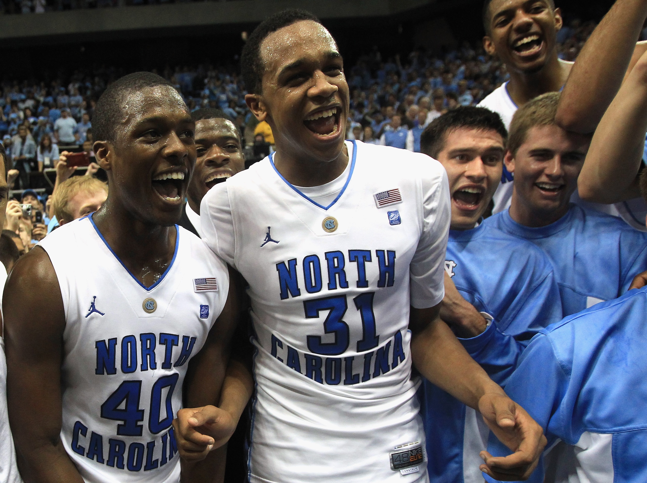 CHAPEL HILL, NC - MARCH 05: Teammates Harrison Barnes #40 and John Henson #31 of the North Carolina Tar Heels celebrate winning the ACC Regular Season Championship as they defeated the Duke Blue Devils 81-67 at the Dean E. Smith Center on March 5, 2011 i CHAPEL HILL, NC - MARCH 05: Teammates Harrison Barnes #40 and John Henson #31 of the North Carolina Tar Heels celebrate winning the ACC Regular Season Championship as they defeated the Duke Blue Devils 81-67 at the Dean E. Smith Center on March 5, 2011 i