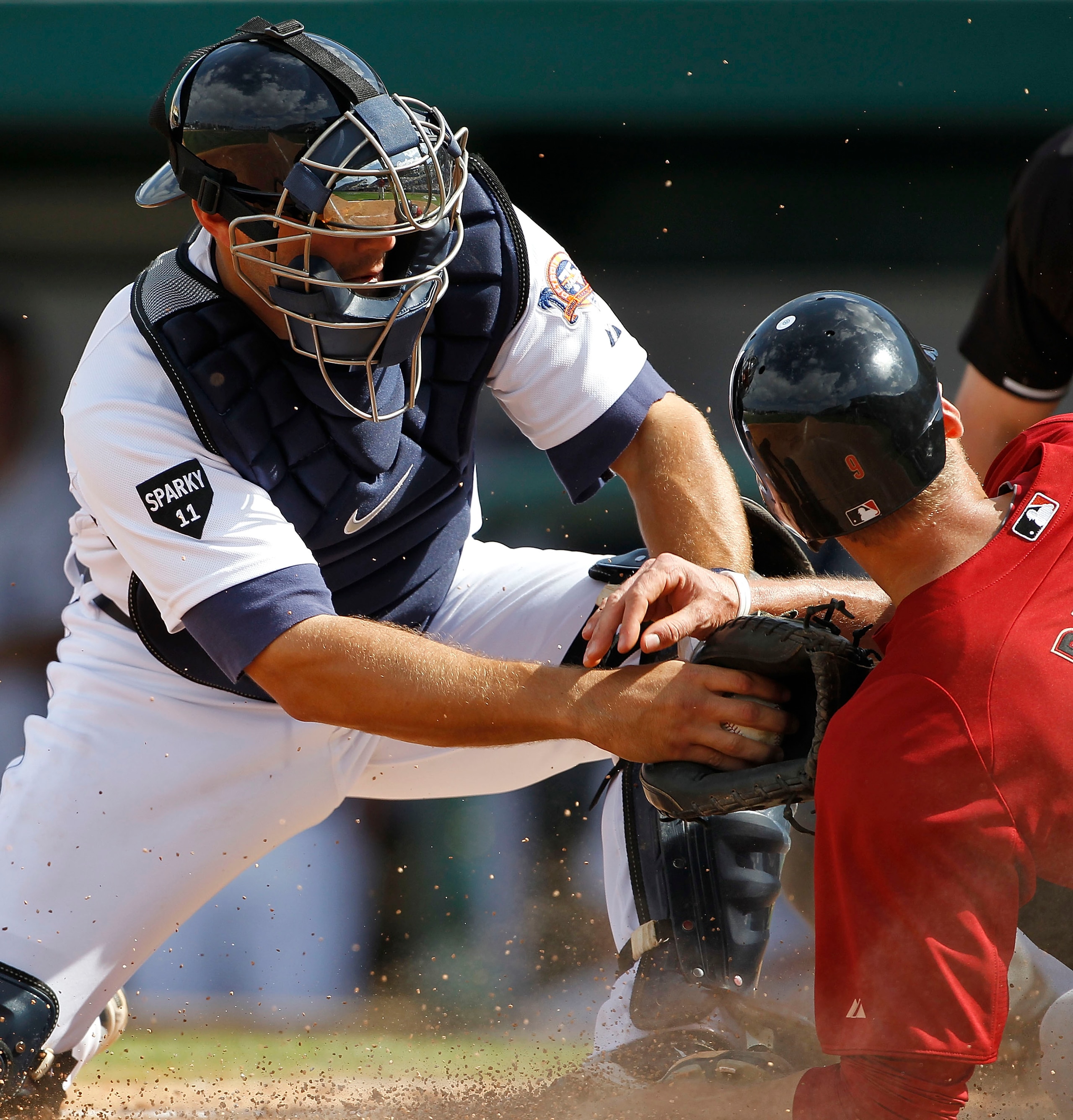 LAKELAND, FL - MARCH 02: Alex Avila #13 of the Detroit Tigers tags out Hunter Pence #9 of the Houston Astros during the game at Joker Marchant Stadium on March 2, 2011 in Lakeland, Florida. The Astros defeated the Tigers 6-3.  (Photo by Leon Halip/Getty I