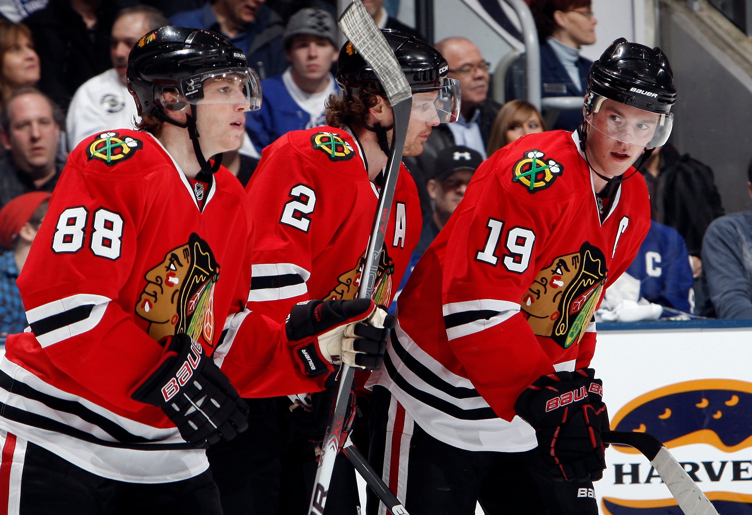 TORONTO, CANADA - MARCH 5: Patrick Kane #88, Duncan Keith #2 and Jonathan Toews #19 of the Chicago Blackhawks celebrate Jonathan Toews' goal during game action against the Toronto Maple Leafs at the Air Canada Centre March 5, 2011 in Toronto, Ontario, Can