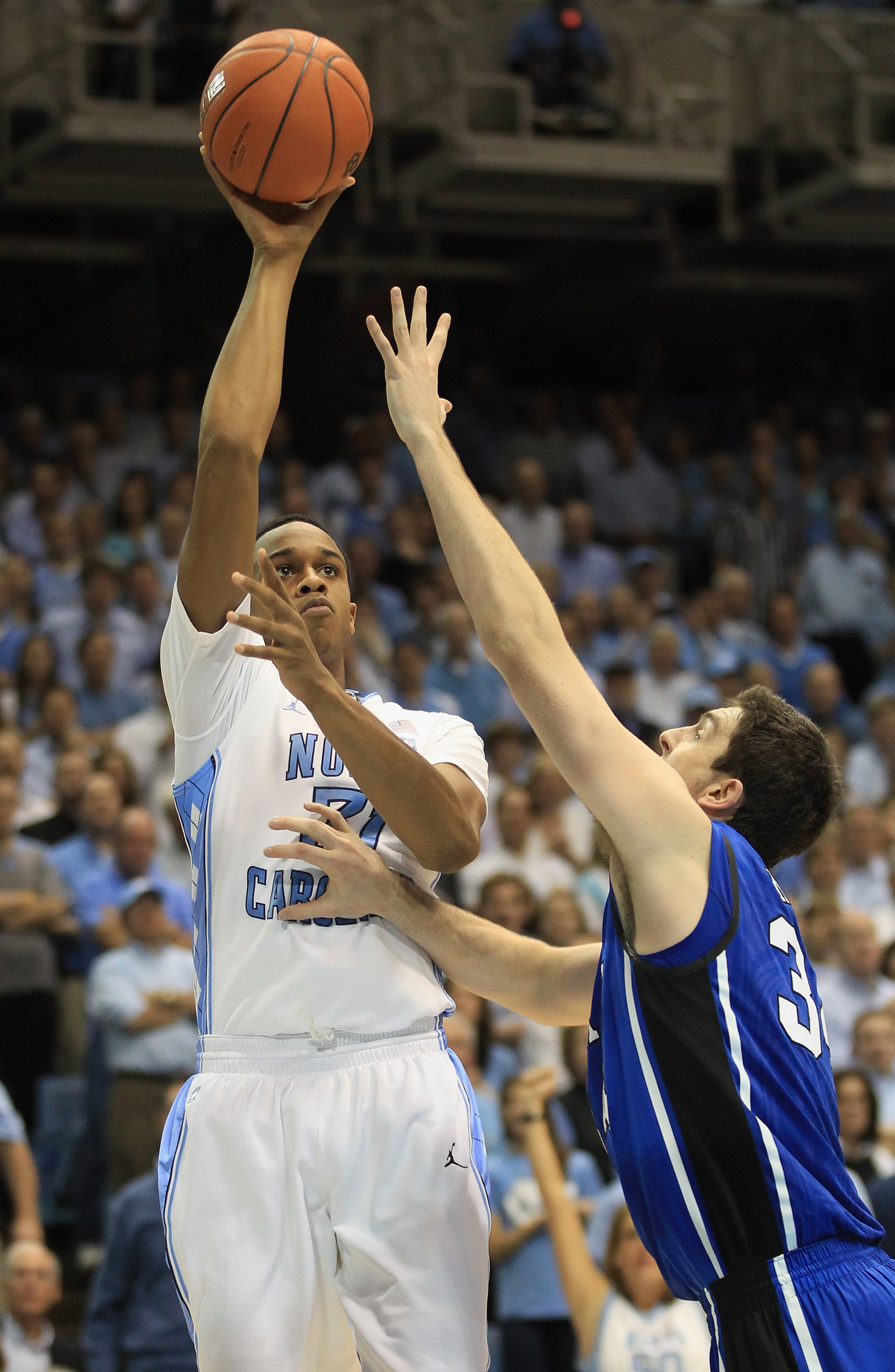 CHAPEL HILL, NC - MARCH 05: Ryan Kelly #34 of the Duke Blue Devils tries to stop John Henson #31 of the North Carolina Tar Heels during their game at the Dean E. Smith Center on March 5, 2011 in Chapel Hill, North Carolina. (Photo by Streeter Lecka/Gett CHAPEL HILL, NC - MARCH 05: Ryan Kelly #34 of the Duke Blue Devils tries to stop John Henson #31 of the North Carolina Tar Heels during their game at the Dean E. Smith Center on March 5, 2011 in Chapel Hill, North Carolina. (Photo by Streeter Lecka/Gett
