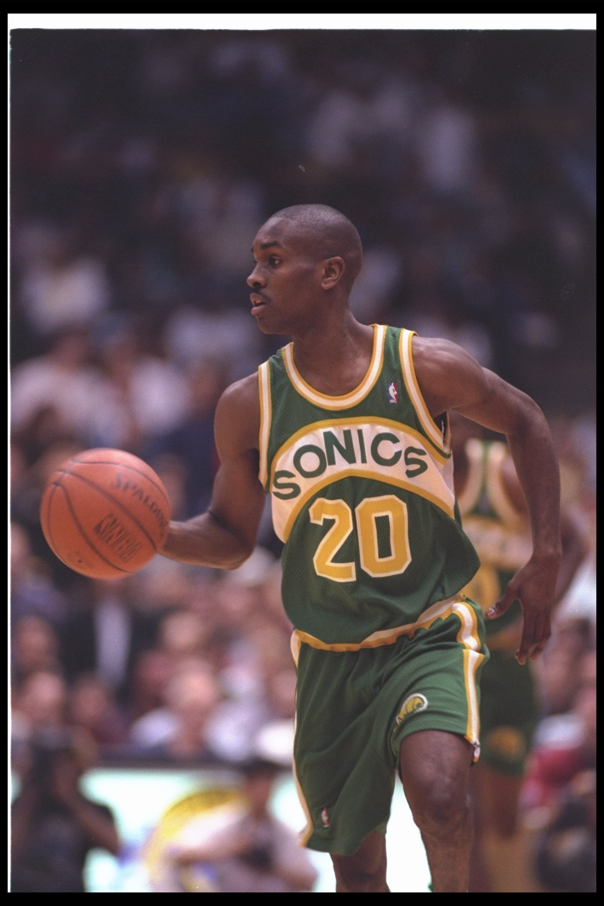 29 Dec 1993: Guard Gary Payton of the Seattle SuperSonics moves the ball during a game against the Los Angeles Lakers at the Great Western Forum in Inglewood, California. Mandatory Credit: J. D. Cuban /Allsport Mandatory Credit: J. D. Cuban /Allsport