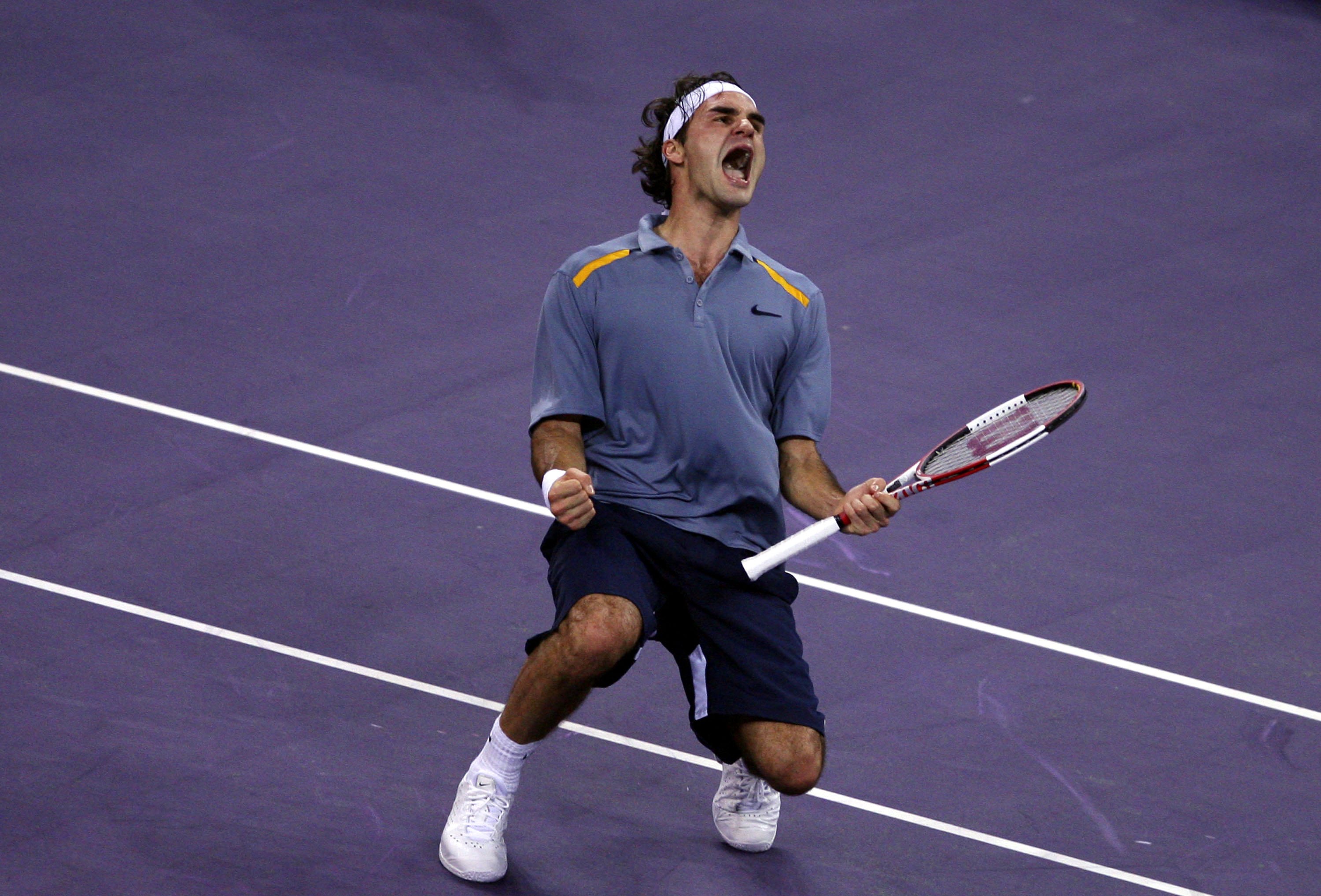 SHANGHAI, CHINA - NOVEMBER 18:  (CHINA OUT) Roger Federer of Switzerland reacts after defeating Rafael Nadal of Spain in the semi-finals of the Tennis Masters Cup Shanghai on November 18, 2006 at the Qi Zhong Tennis Stadium in Shanghai, China. (Photo by C