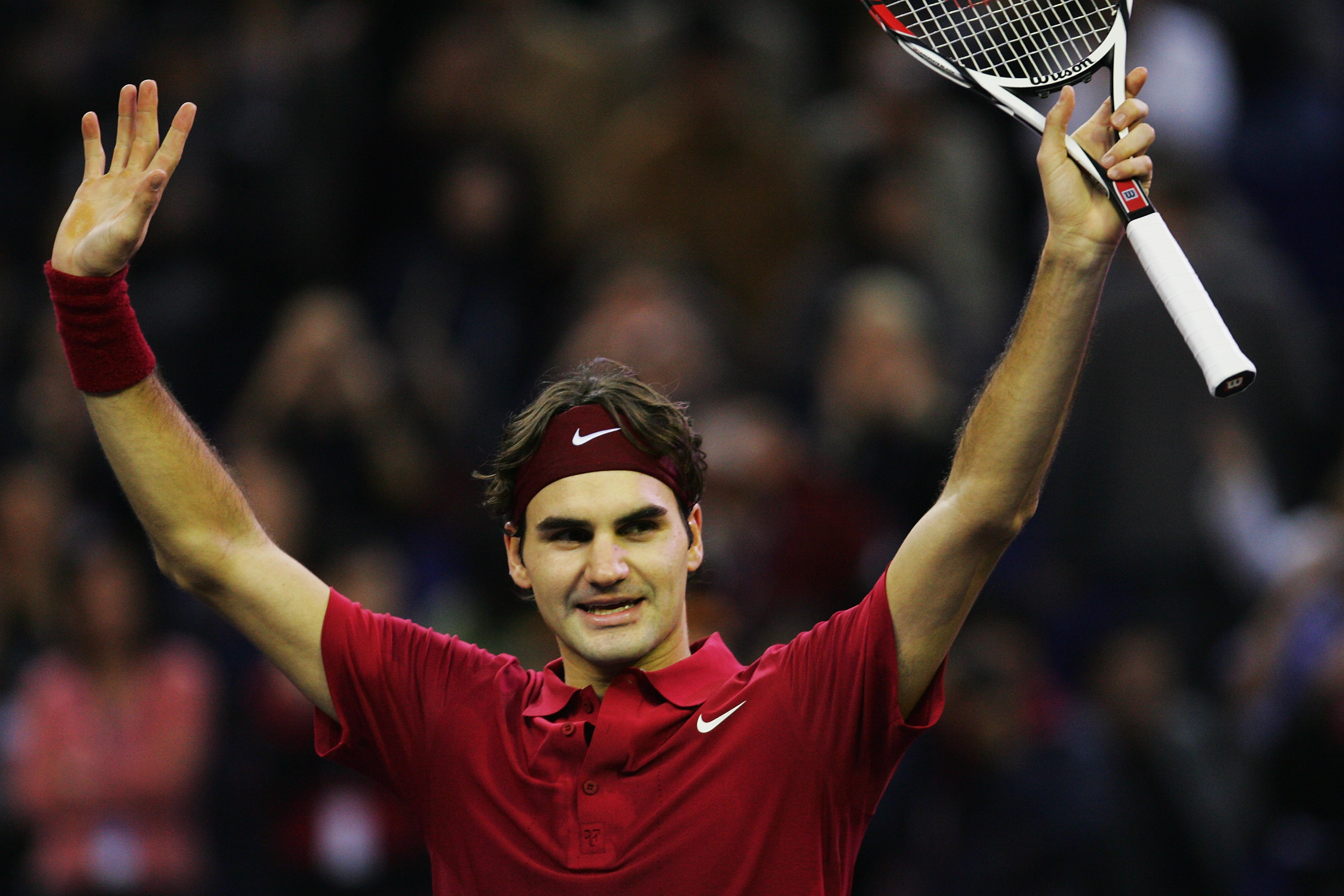 SHANGHAI, CHINA - NOVEMBER 18:  Roger Federer of Switzerland celebrates after he beat David Ferrer of Spain in the final match of the Tennis Masters Cup at Qi Zhong Stadium on November 18, 2007 in Shanghai, China.  (Photo by Andrew Wong/Getty Images)