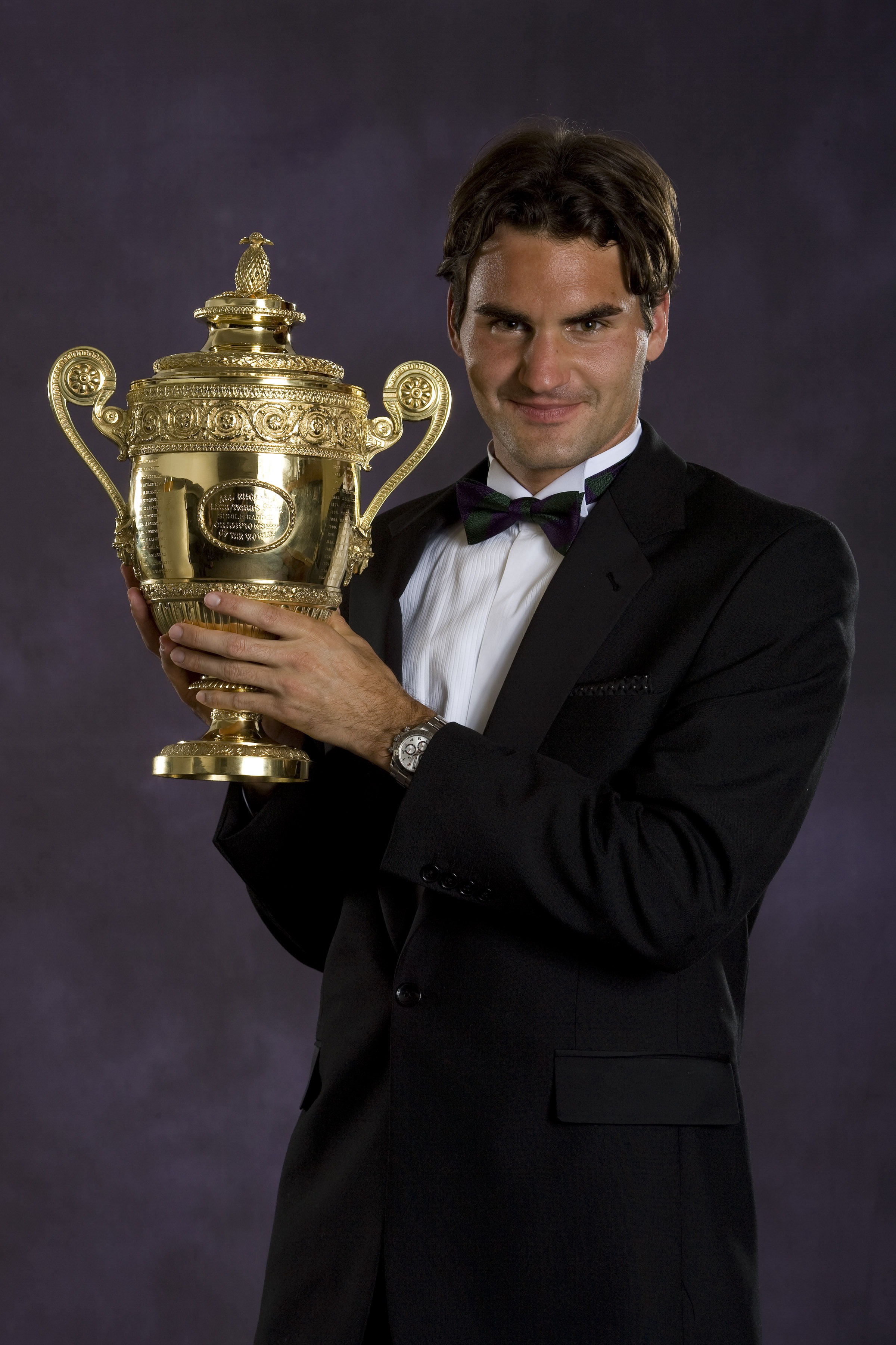 LONDON - JULY 8:  Roger Federer of Switzerland, men's singles Wimbledon champion, poses with the trophy at the Champions' Dinner on July 8, 2007 at The Savoy, London, England. (Photo by Bob Martin-Pool/Getty Images)