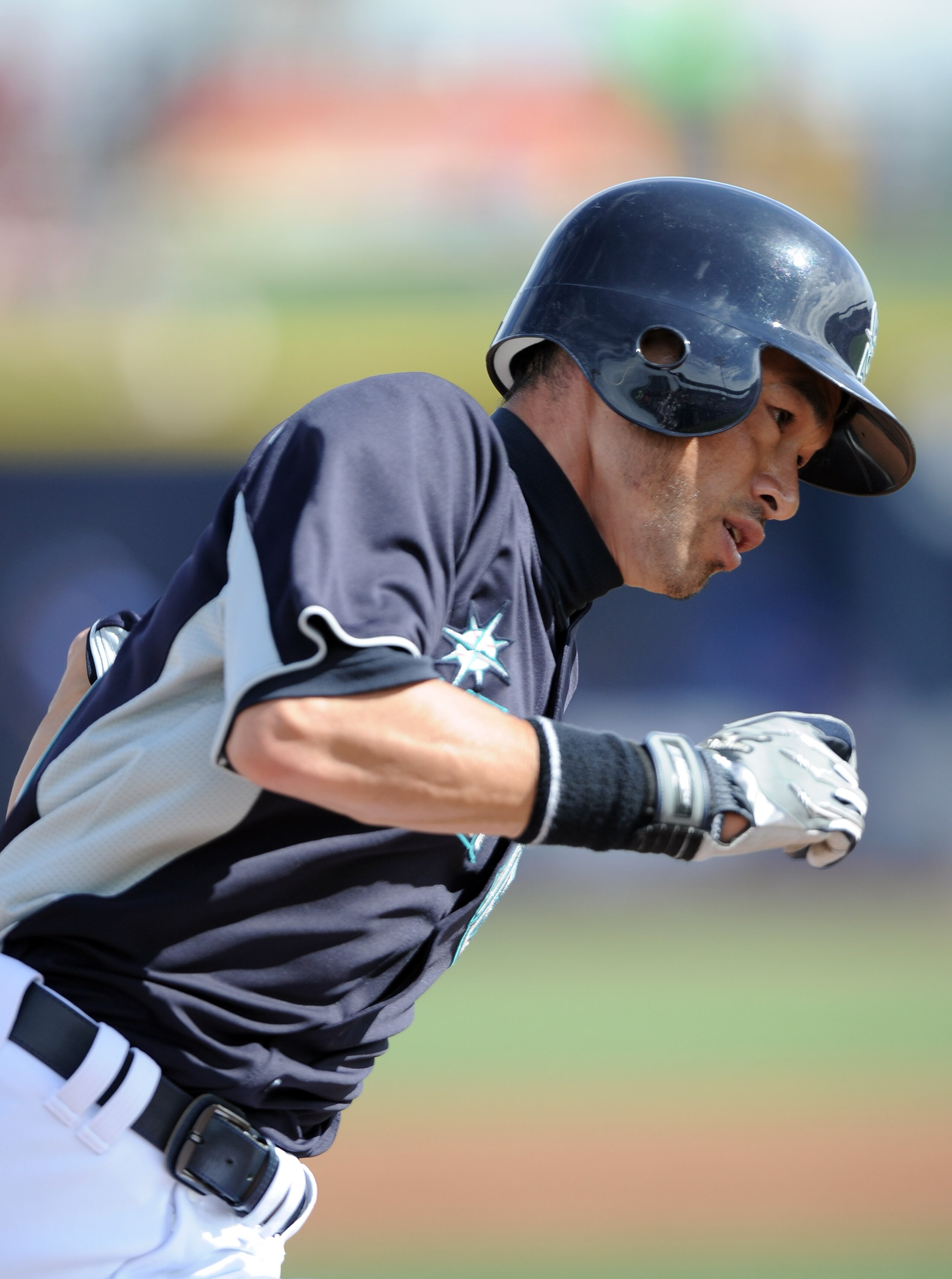 PEORIA, AZ - MARCH 01:  Ichiro Suzuki #51 of the Seattle Mariners runs home to score against the Texas Rangers during spring training at Peoria Stadium on March 1, 2011 in Peoria, Arizona.  (Photo by Harry How/Getty Images)
