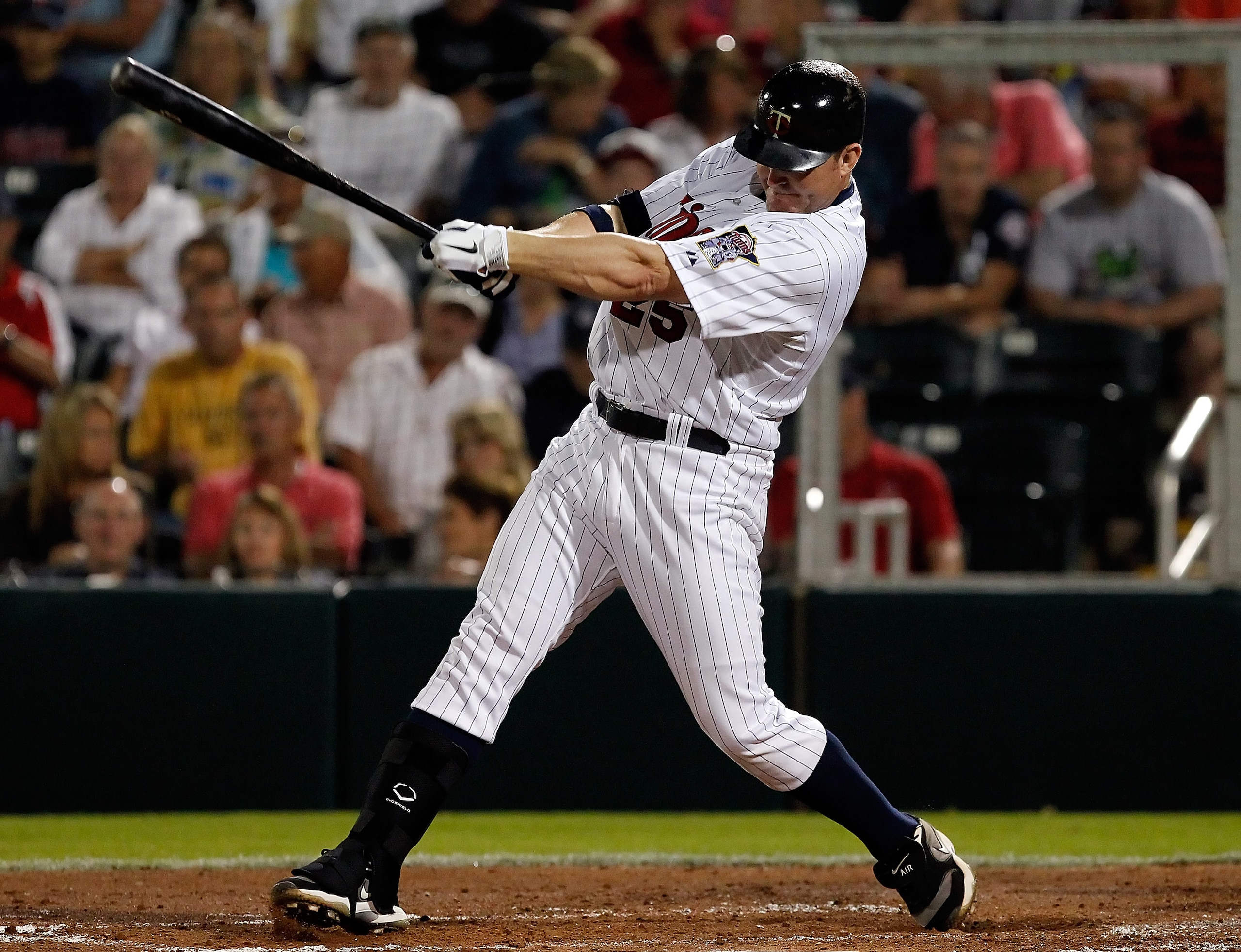 FORT MYERS, FL - FEBRUARY 27:  Designated hitter Jim Thome #25 of the Minnesota Twins fouls off a pitch during a game against the Boston Red Sox during a Grapefruit League Spring Training Game at Hammond Stadium on February 27, 2011 in Fort Myers, Florida