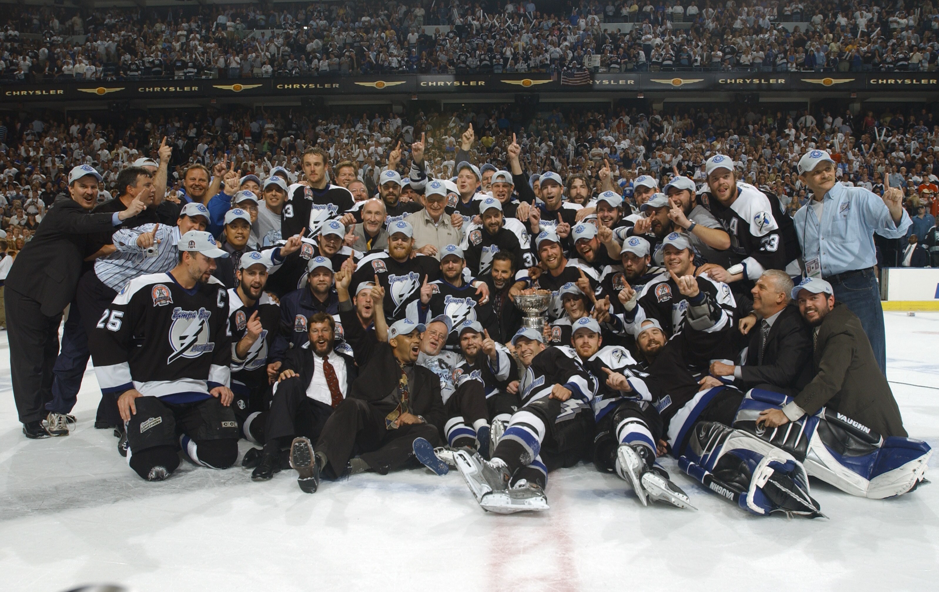 TAMPA, FL - JUNE 7:  Tampa Bay Lightning players and staff pose for a team photo with the Stanley Cup after defeating the Calgary Flames in Game seven of the NHL Stanley Cup Finals on June 7, 2004 at the St. Pete Times Forum in Tampa, Florida. The Lightni
