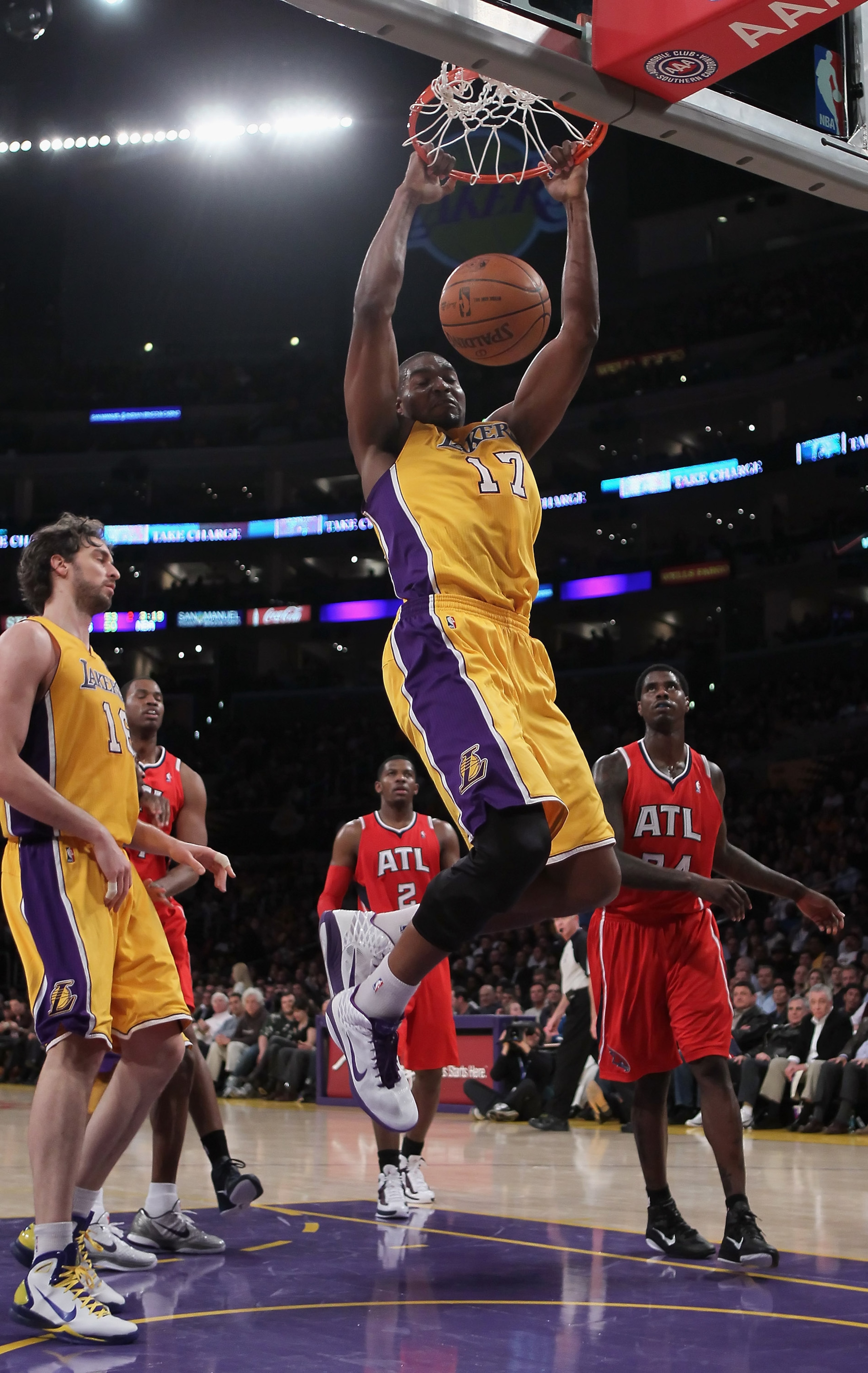 LOS ANGELES, CA - FEBRUARY 22:  Andrew Bynum #17 of the Los Angeles Lakers drives to the basket for a dunk against the Atlanta Hawks in the first half at Staples Center on February 22, 2011 in Los Angeles, California. NOTE TO USER: User expressly acknowle