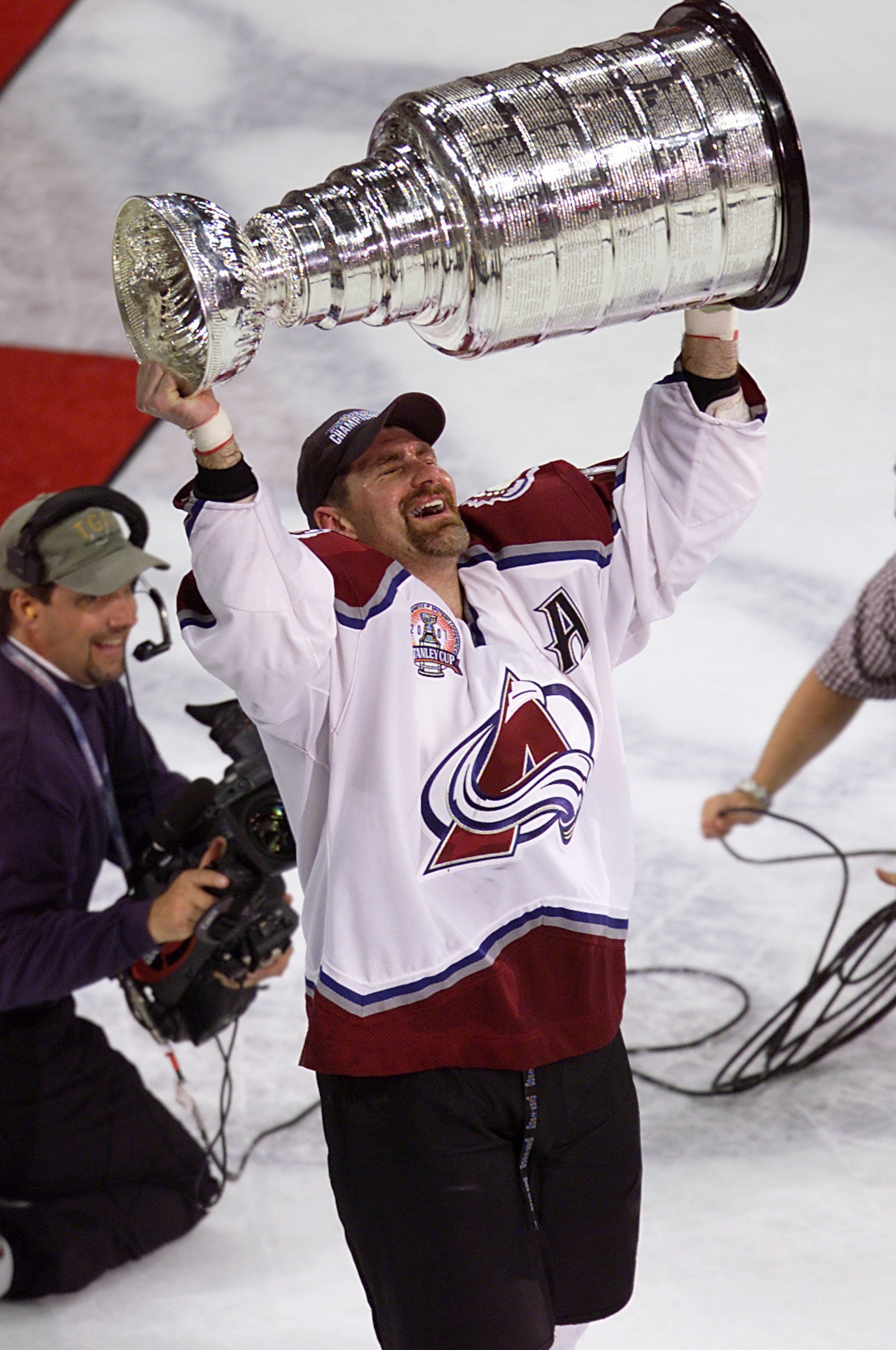 9 Jun 2001:  Ray Bourque #77 of the Colorado Avalanche skates away with the Stanley Cup after 22 seasons in pursuit of the NHL Stanley Cup Championship. Denver, Colorado.  DIGITAL IMAGE.  Mandatory Credit: Brian Bahr/ALLSPORT