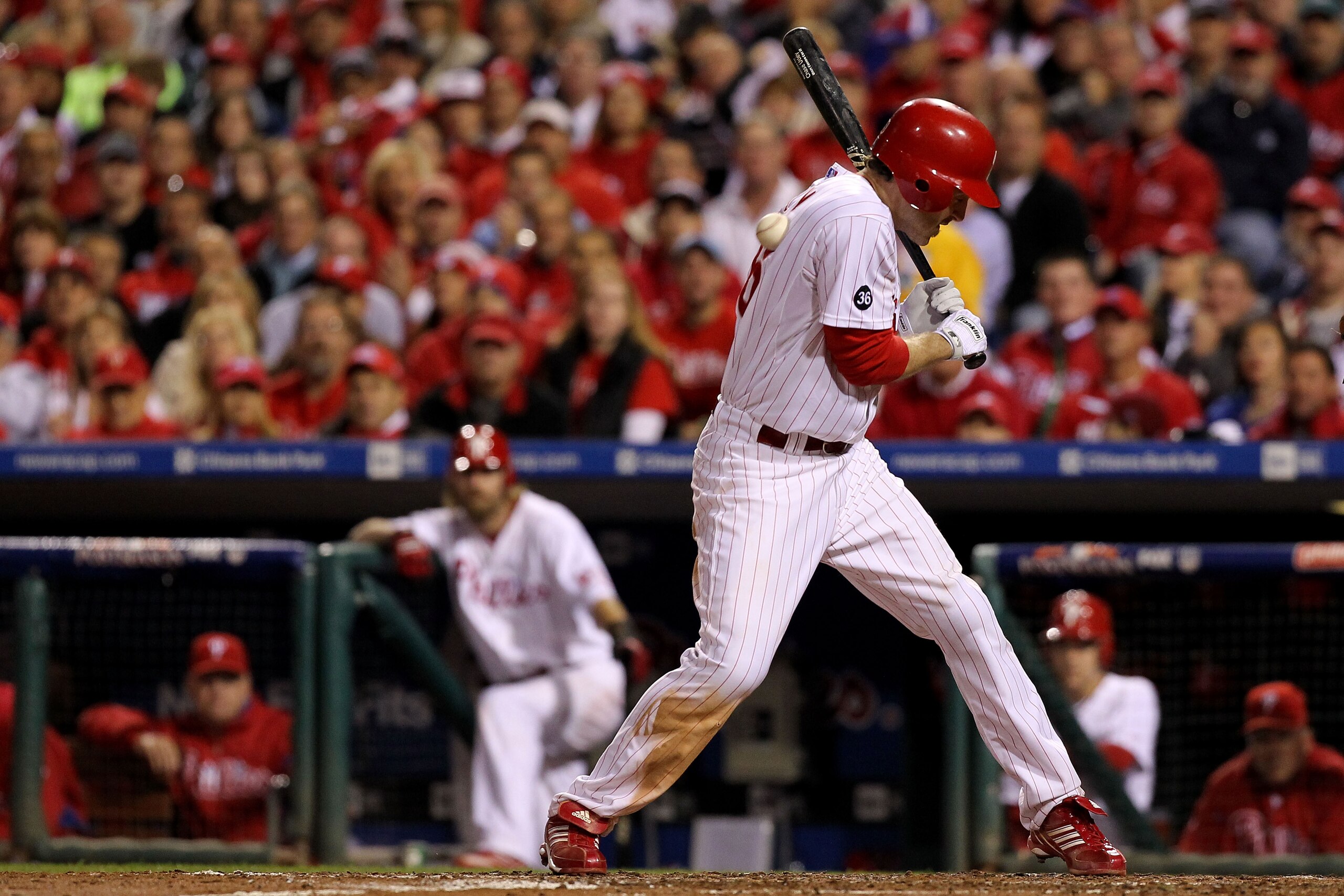 PHILADELPHIA - OCTOBER 23:  Chase Utley #26 of the Philadelphia Phillies is hit by a pitch in the third inning against the San Francisco Giants in Game Six of the NLCS during the 2010 MLB Playoffs at Citizens Bank Park on October 23, 2010 in Philadelphia,