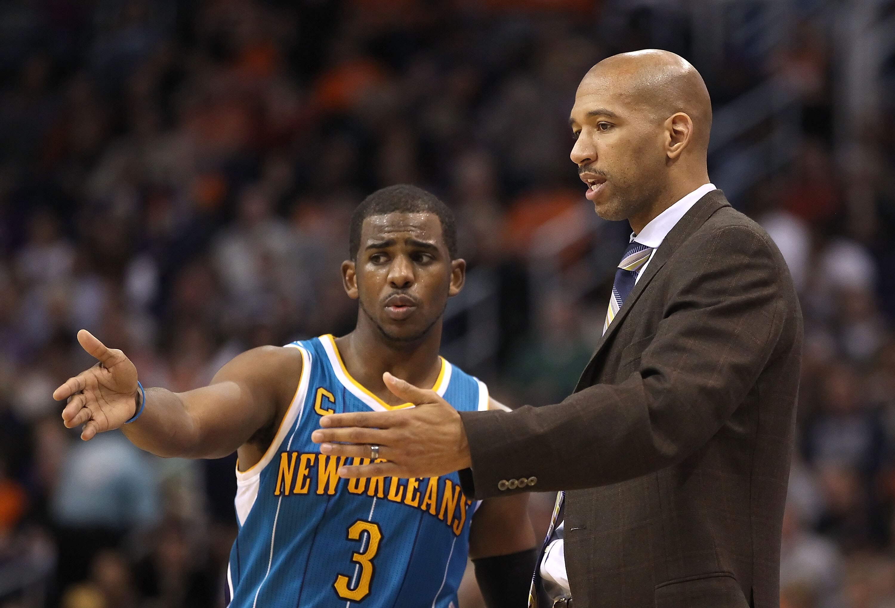 PHOENIX, AZ - JANUARY 30:  Chris Paul #3 of the New Orleans Hornets talks with head coach Monty Williams during the NBA game against the Phoenix Suns at US Airways Center on January 30, 2011 in Phoenix, Arizona. The Suns defeated the Hornets 104-102. NOTE