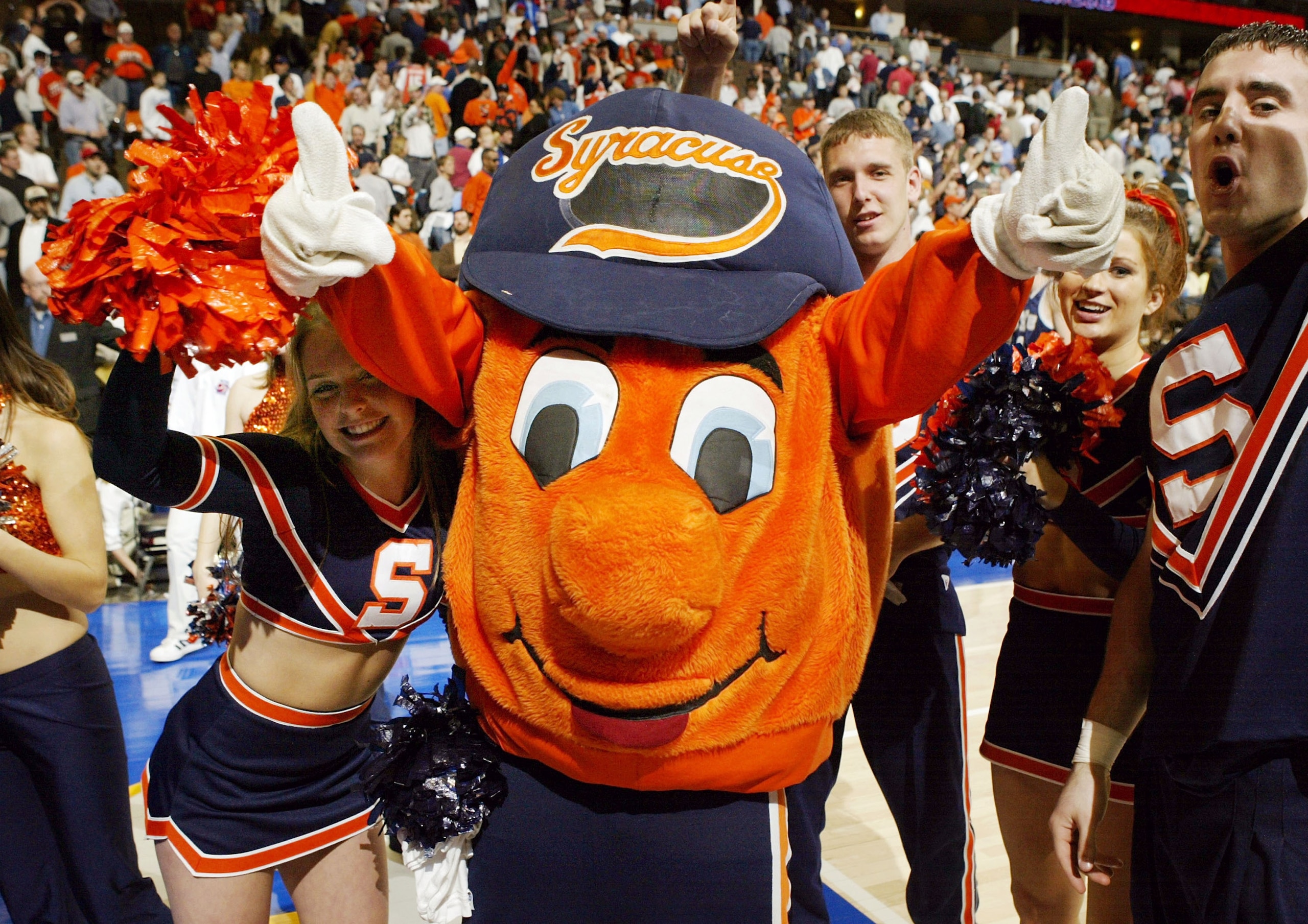 DENVER - MARCH 18:   Syracuse's mascot Otto the Orangemen and team cheerleaders celebrate a win over the BYU Cougars during their first round game of the NCAA Division I Men's Basketball Tournament March 18, 2004 at Pepsi Center in Denver, Colorado. Syrac
