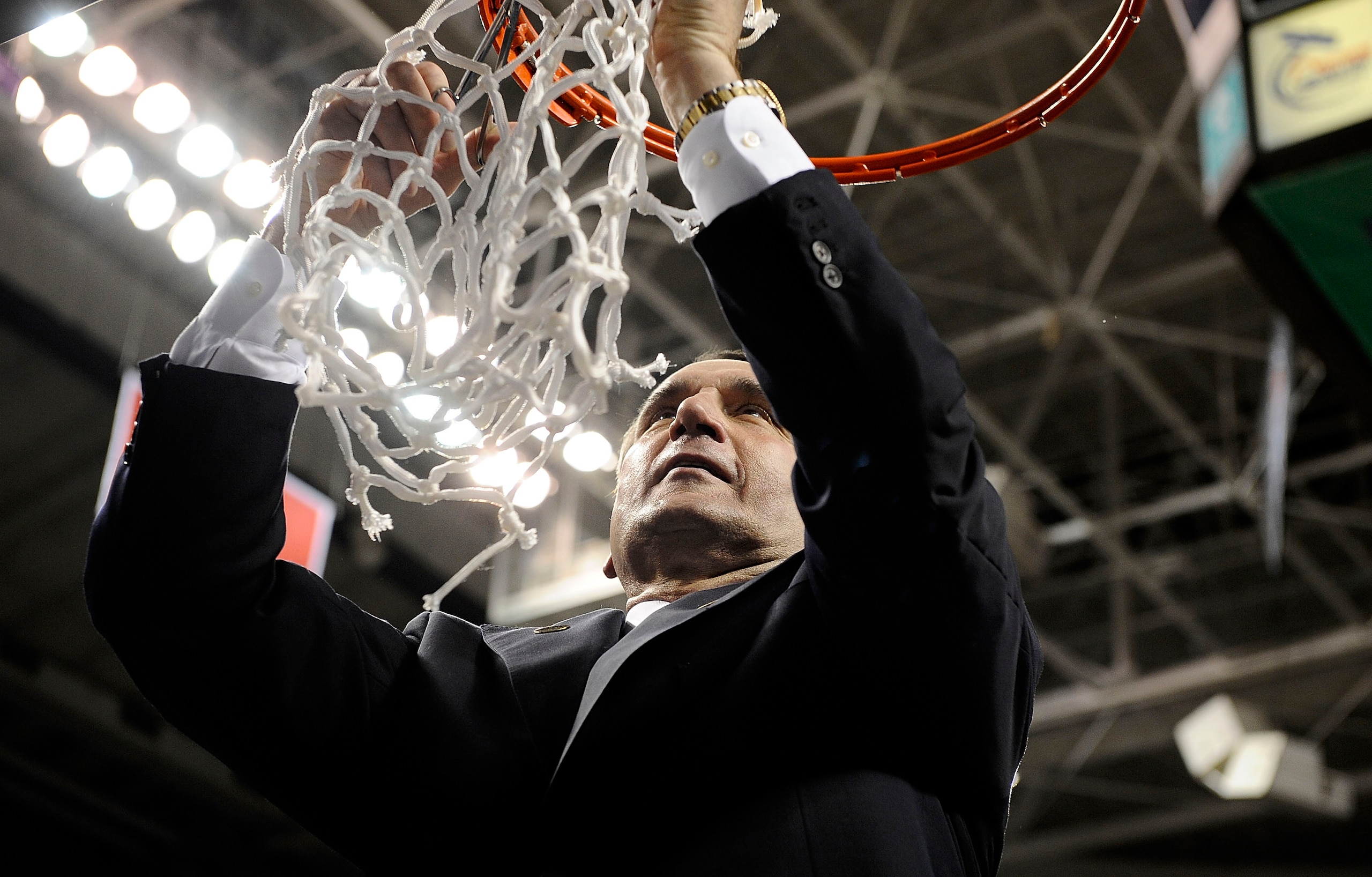 GREENSBORO, NC - MARCH 14: Mike Krzyzewski head coach of the Duke Blue Devils cuts down the net after win over the Georgia Tech Yellow Jackets in the championship game of the 2010 ACC Men's Basketball Tournament at the Greensboro Coliseum on March 14, 201