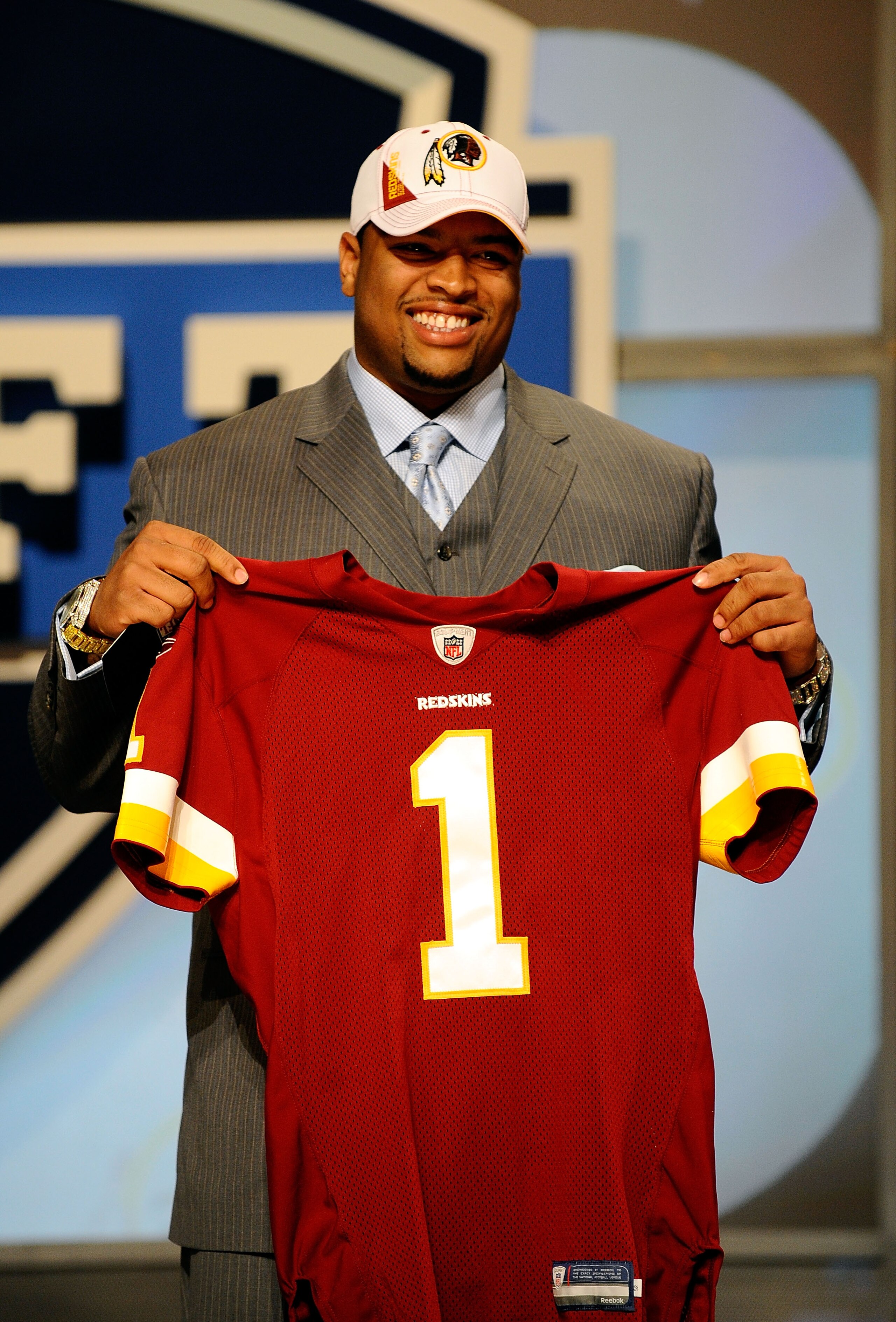 NEW YORK - APRIL 22:  Trent Williams (R) of the Oklahoma Sooners holds a Washington Redskins jersey after Washington selected Williams #4 overall ini the first round during the 2010 NFL Draft at Radio City Music Hall on April 22, 2010 in New York City.  (