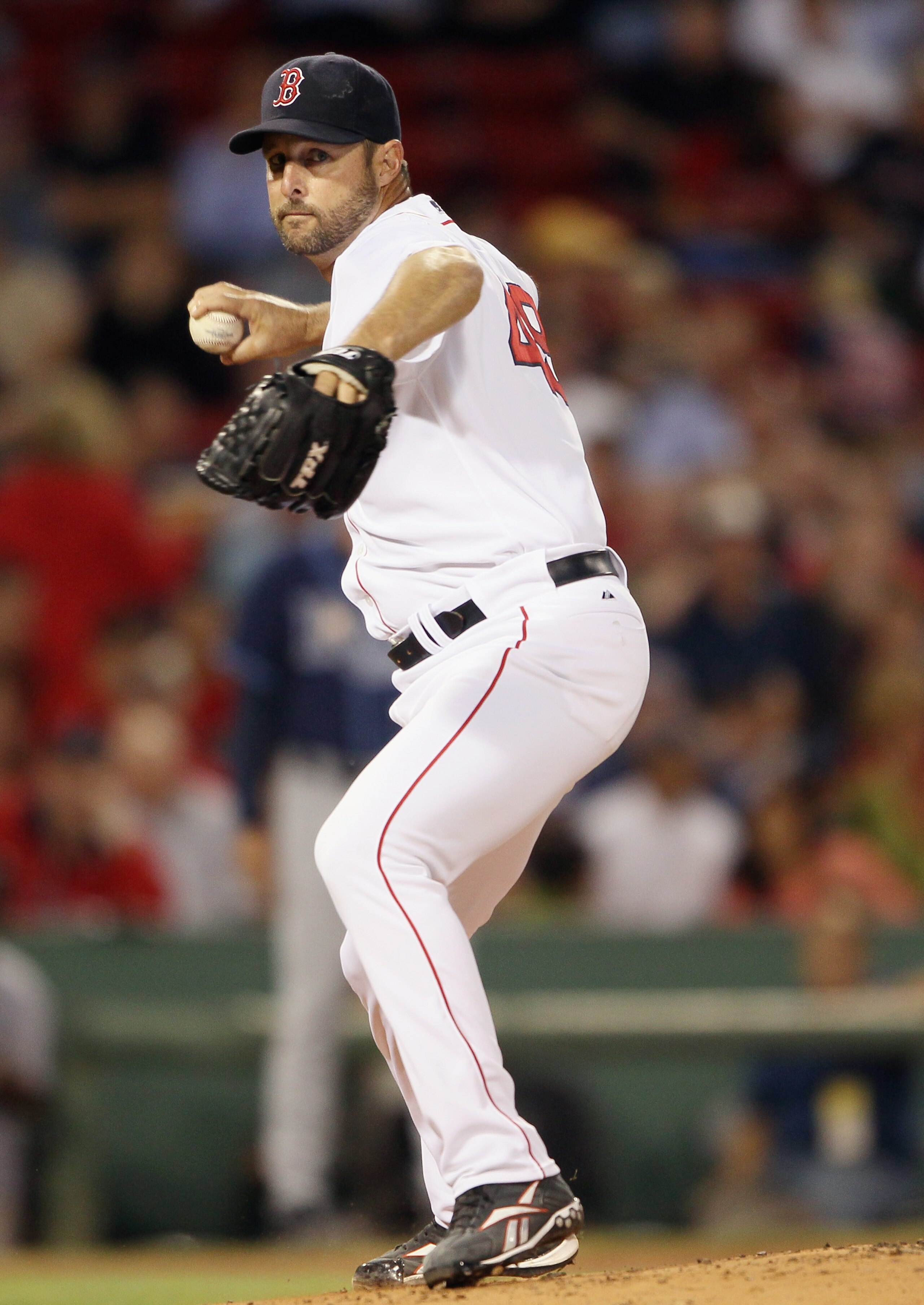 BOSTON - SEPTEMBER 08:  Tim Wakefield #49 of the Boston Red Sox sends the ball to first base in an attempt to catch Ben Zobrist of the Tampa Bay Rays leading off on September 8, 2010 at Fenway Park in Boston, Massachusetts.  (Photo by Elsa/Getty Images)