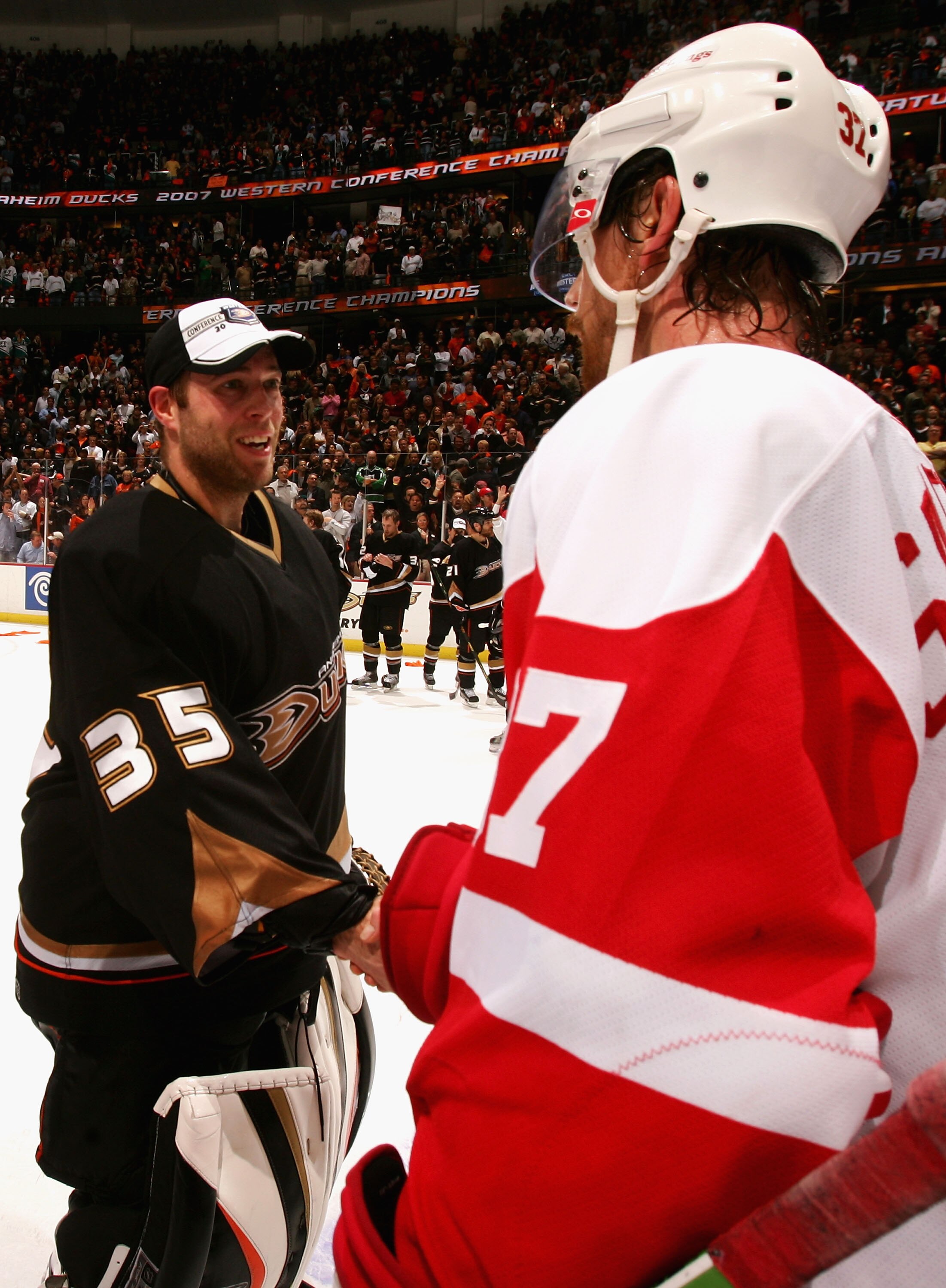 ANAHEIM, CA - MAY 22:  Mikael Samuelsson #37 of the Detroit Red Wings congratulates goaltender Jean-Sebastien Giguere #35 of the Anaheim Ducks after Game Six of the 2007 Western Conference finals on May 22, 2007 at Honda Center in Anaheim, California.  Th