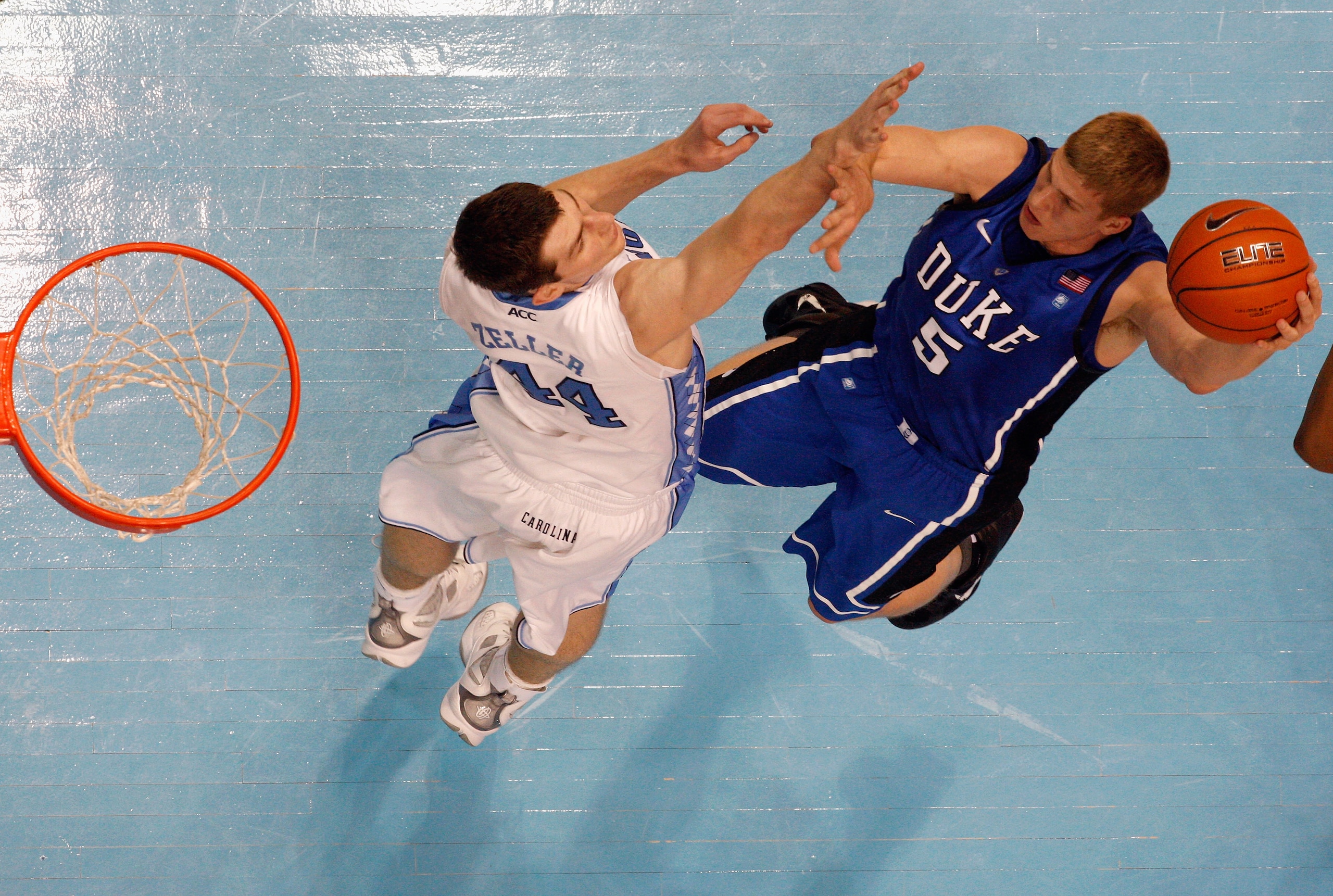 CHAPEL HILL, NC - MARCH 05: Mason Plumlee #5 of the Duke Blue Devils shoots over Tyler Zeller #44 of the North Carolina Tar Heels during their game at the Dean E. Smith Center on March 5, 2011 in Chapel Hill, North Carolina. (Photo by Streeter Lecka/Get CHAPEL HILL, NC - MARCH 05: Mason Plumlee #5 of the Duke Blue Devils shoots over Tyler Zeller #44 of the North Carolina Tar Heels during their game at the Dean E. Smith Center on March 5, 2011 in Chapel Hill, North Carolina. (Photo by Streeter Lecka/Get