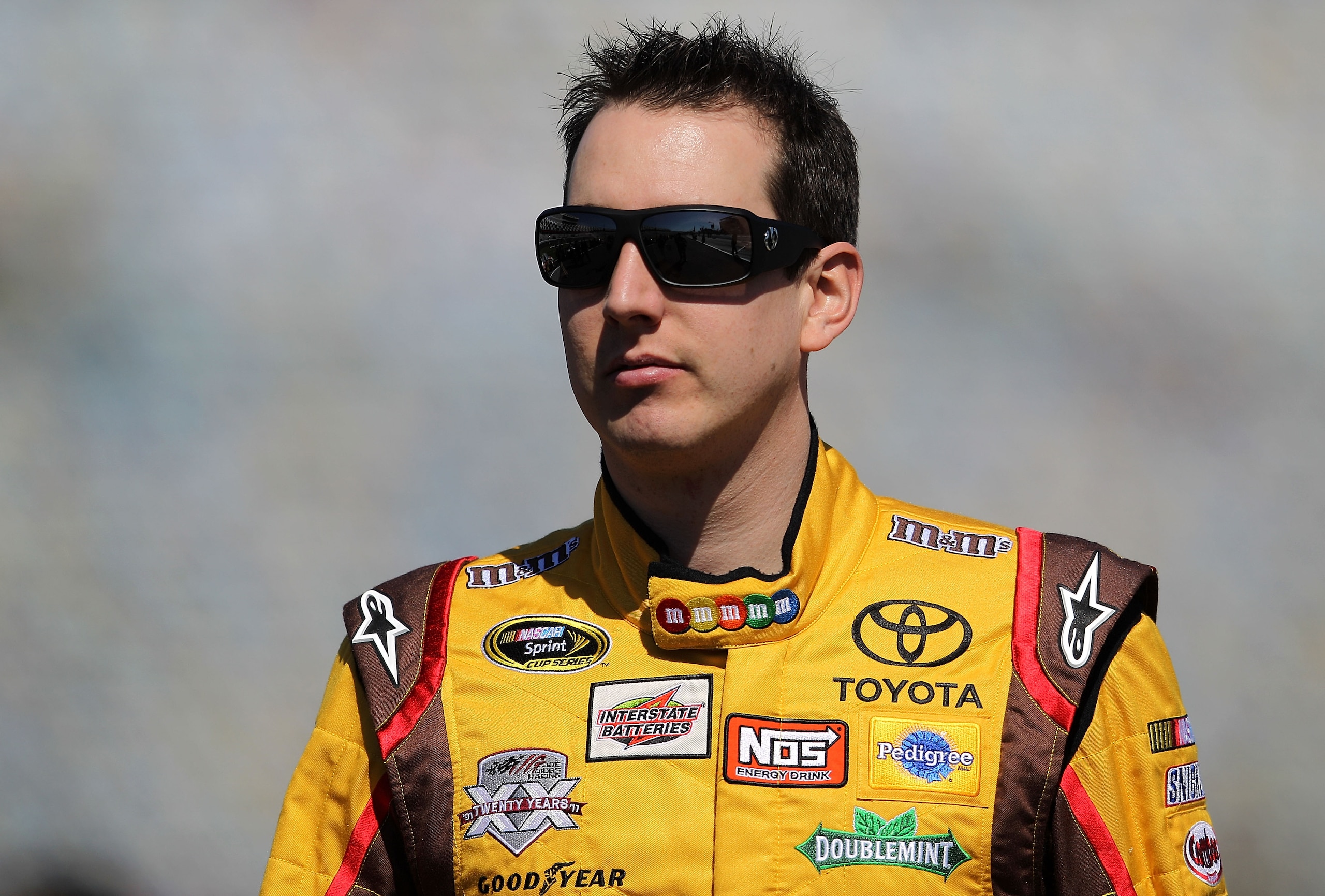 DAYTONA BEACH, FL - FEBRUARY 13:  Kyle Busch, driver of the #18 M&M's Toyota, walks during qualifying for the NASCAR Sprint Cup Series Daytona 500 at Daytona International Speedway on February 13, 2011 in Daytona Beach, Florida.  (Photo by Nick Laham/Gett