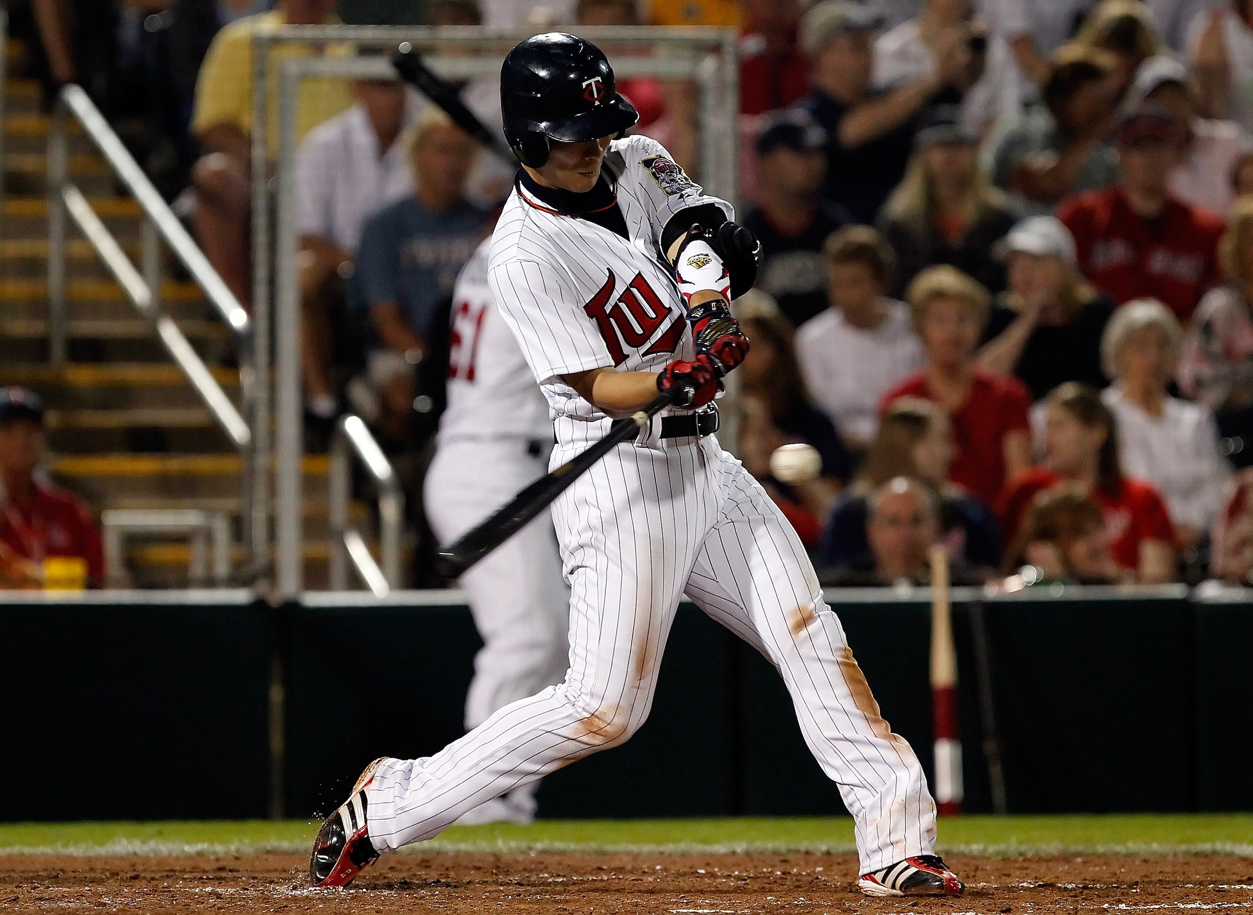 FORT MYERS, FL - FEBRUARY 27:  Infielder Tsuyoshi Nishioka #1 of the Minnesota Twins gets a hit against the Boston Red Sox during a Grapefruit League Spring Training Game at Hammond Stadium on February 27, 2011 in Fort Myers, Florida.  (Photo by J. Meric/