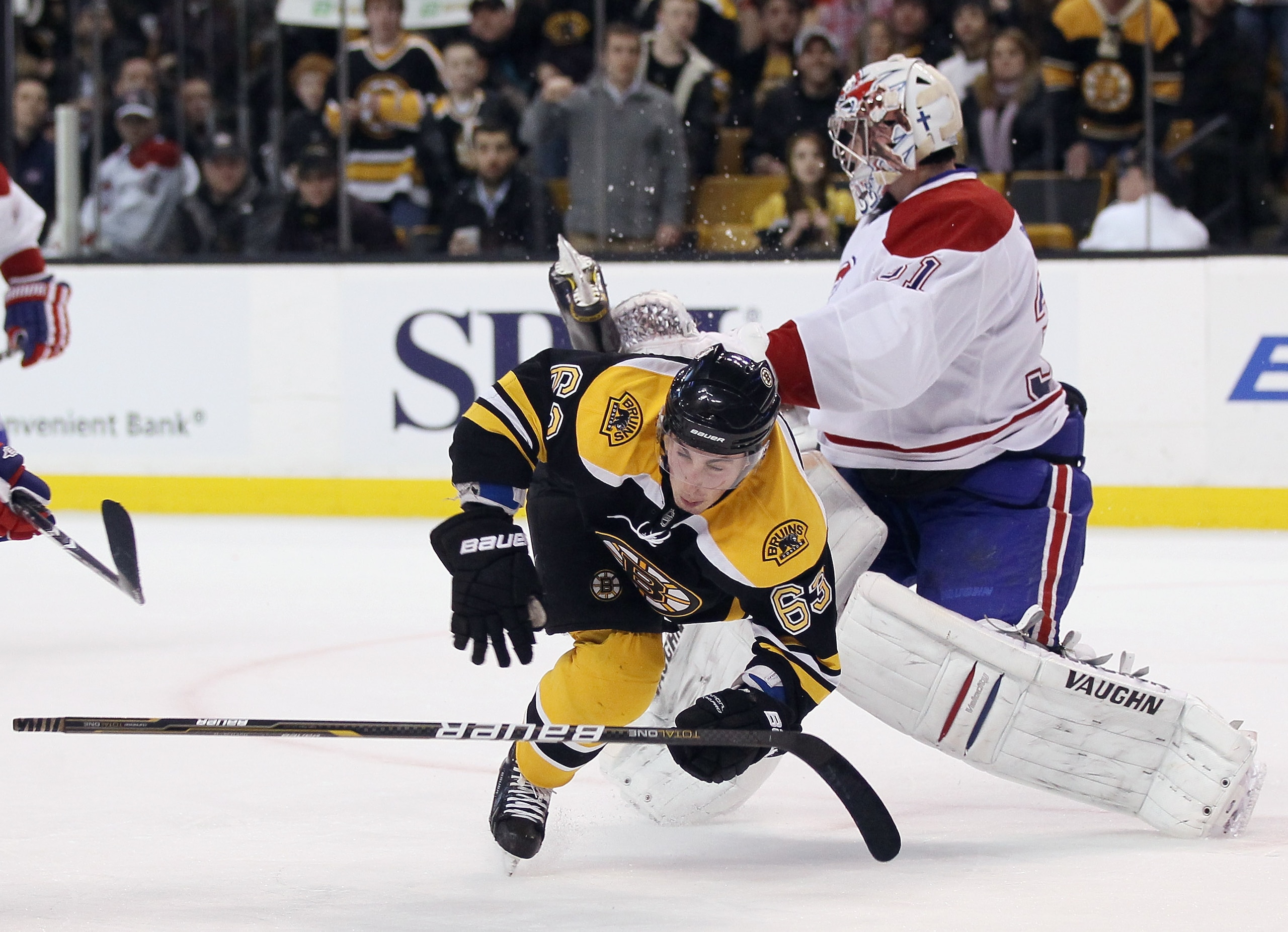 BOSTON, MA - FEBRUARY 09:  Brad Marchand #63 of the Boston Bruins collides with Carey Price #31 of the Montreal Canadiens on February 9, 2011 at the TD Garden in Boston, Massachusetts. The Bruins defeated the Canadiens 8-6.  (Photo by Elsa/Getty Images)