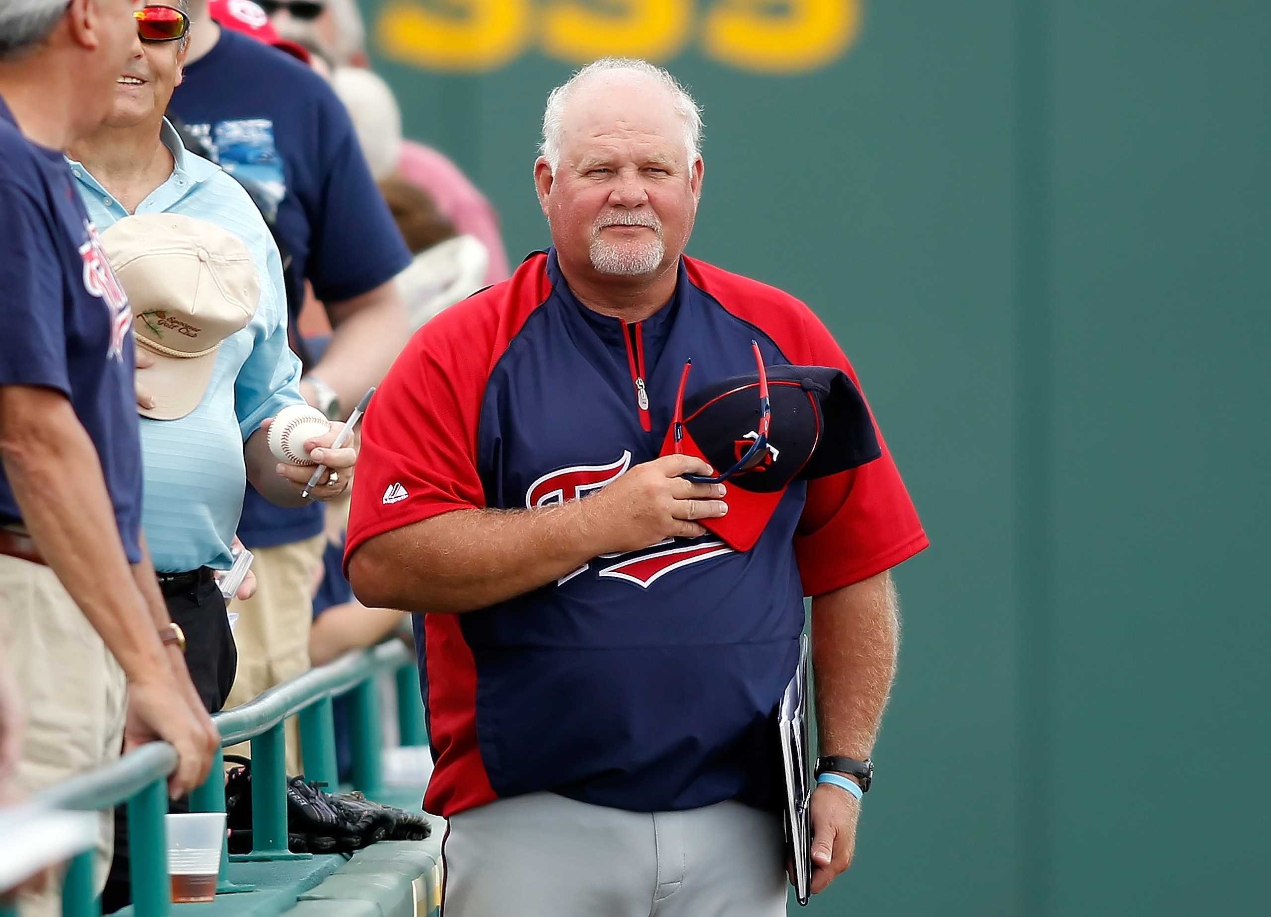 BRADENTON, FL - MARCH 02:  Manager Ron Gardenhire #35 of the Minnesota Twins listens to the National Anthem just before the start of the Grapefruit League Spring Training Game against the Pittsburgh Pirates during a at McKechnie Field on March 2, 2011 in