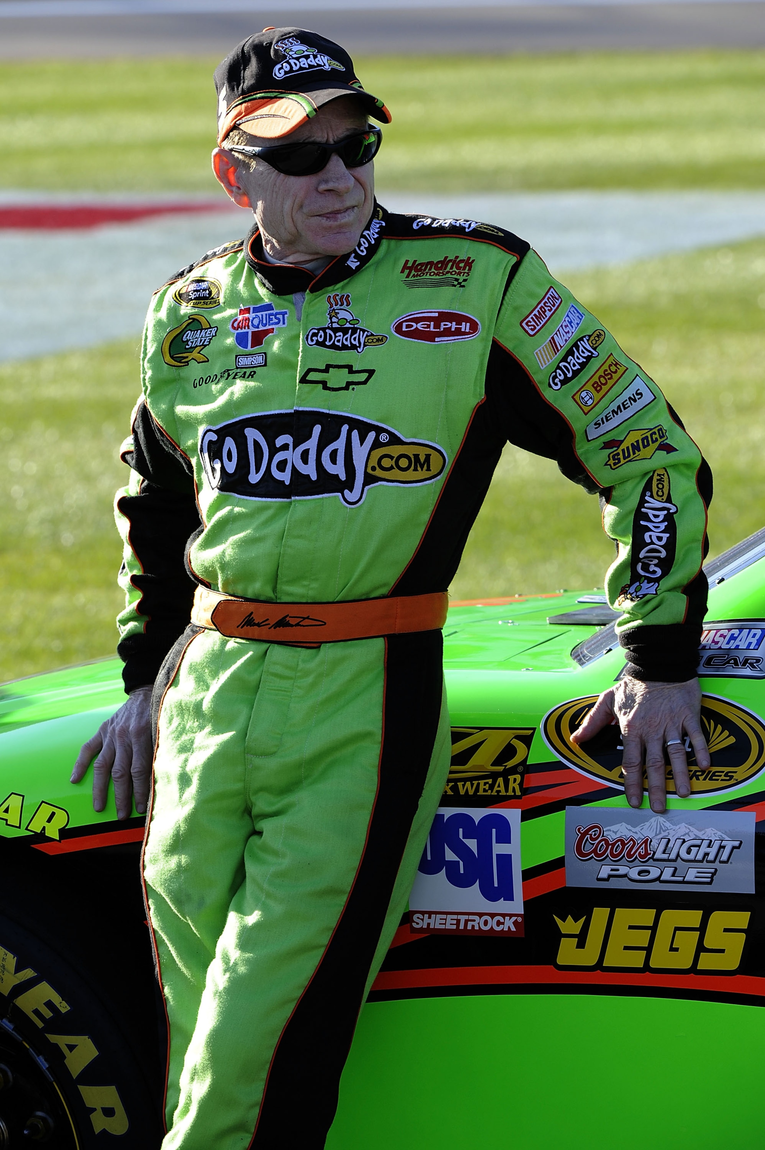 LAS VEGAS, NV - MARCH 04:  Mark Martin, driver of the #5 GoDaddy.com Chevrolet, leans on his car during qualifying for the NASCAR Sprint Cup Series Kobalt Tools 400 at Las Vegas Motor Speedway on March 4, 2011 in Las Vegas, Nevada.  (Photo by John Harrels