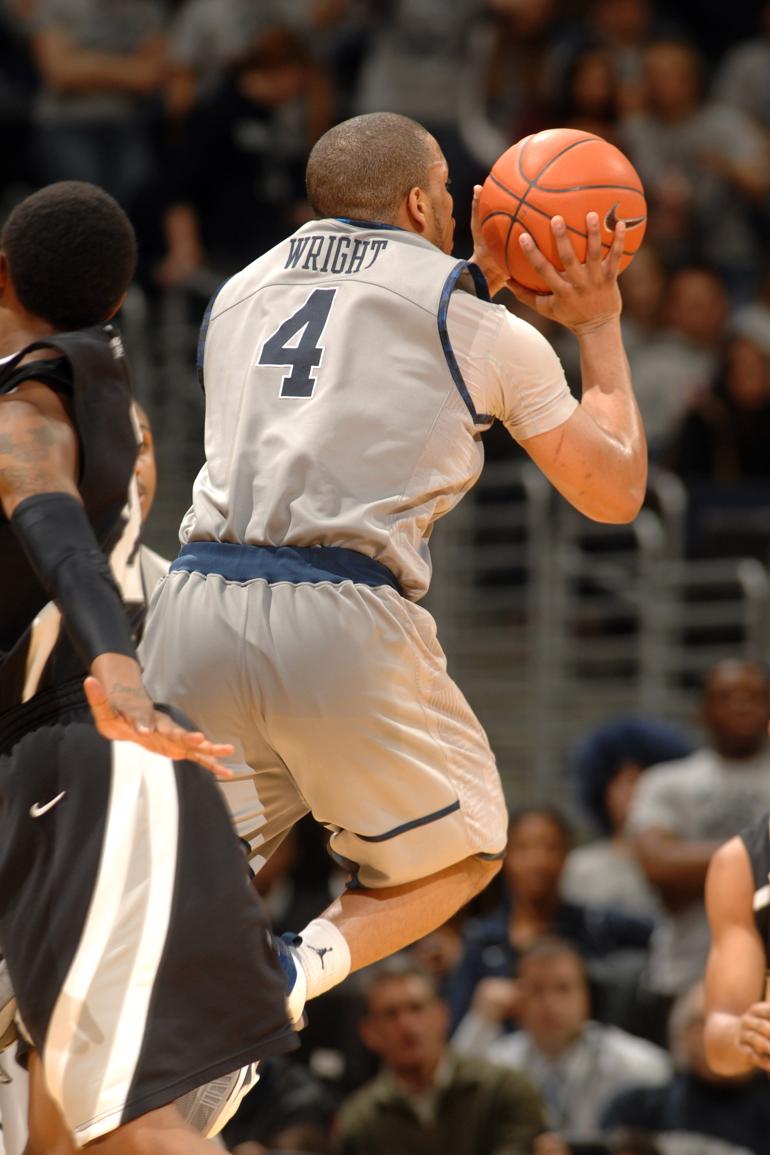 WASHINGTON, DC - FEBRUARY 5:  Chris Wright #4 of the Georgetown Hoyas takes a shot during a college basketball against the Providence Friars on February 5, 2011 at the Verizon Center in Washington, DC.  The Hoyas won 83-81.  (Photo by Mitchell Layton/Gett