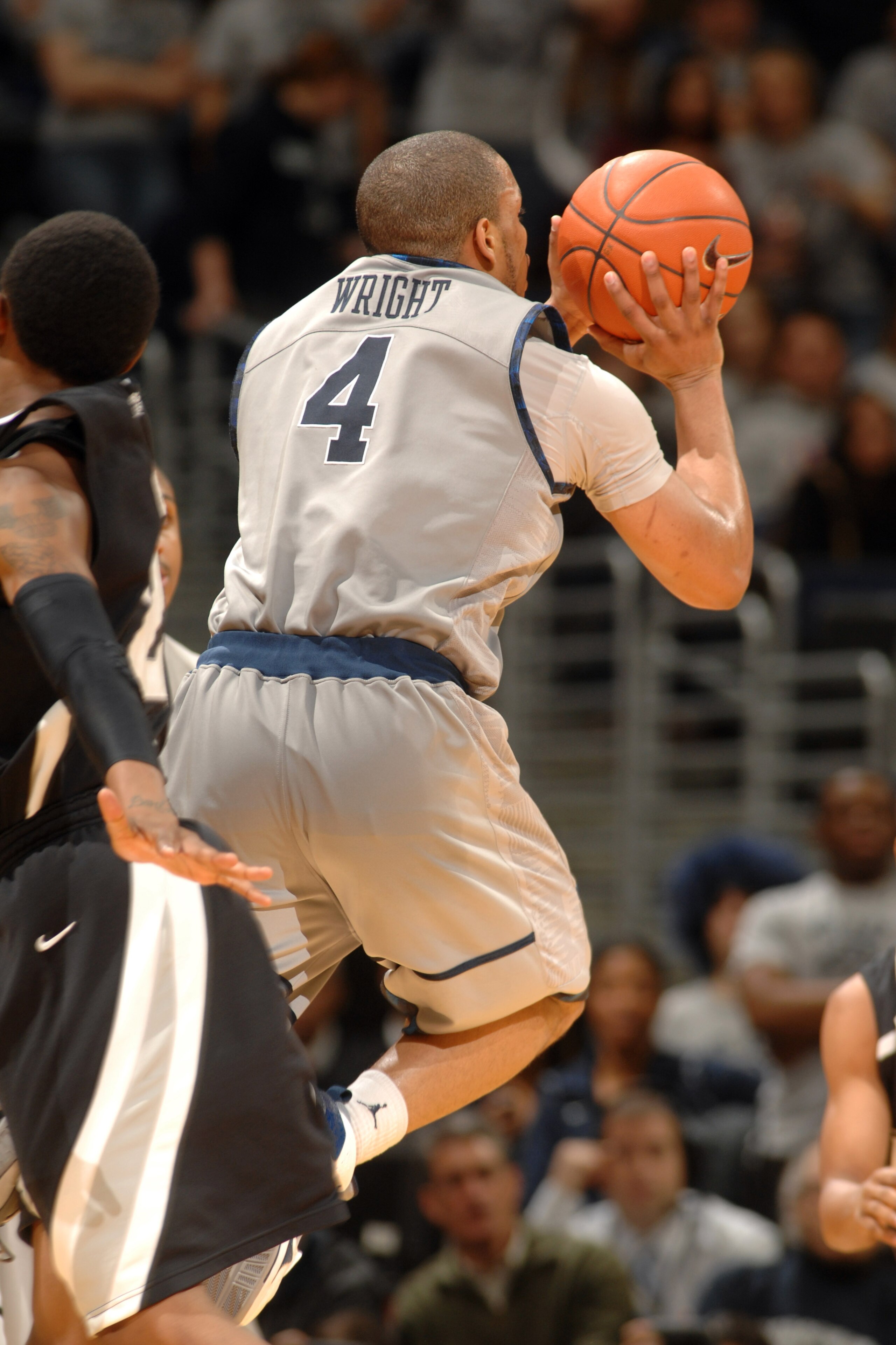 WASHINGTON, DC - FEBRUARY 5:  Chris Wright #4 of the Georgetown Hoyas takes a shot during a college basketball against the Providence Friars on February 5, 2011 at the Verizon Center in Washington, DC.  The Hoyas won 83-81.  (Photo by Mitchell Layton/Gett