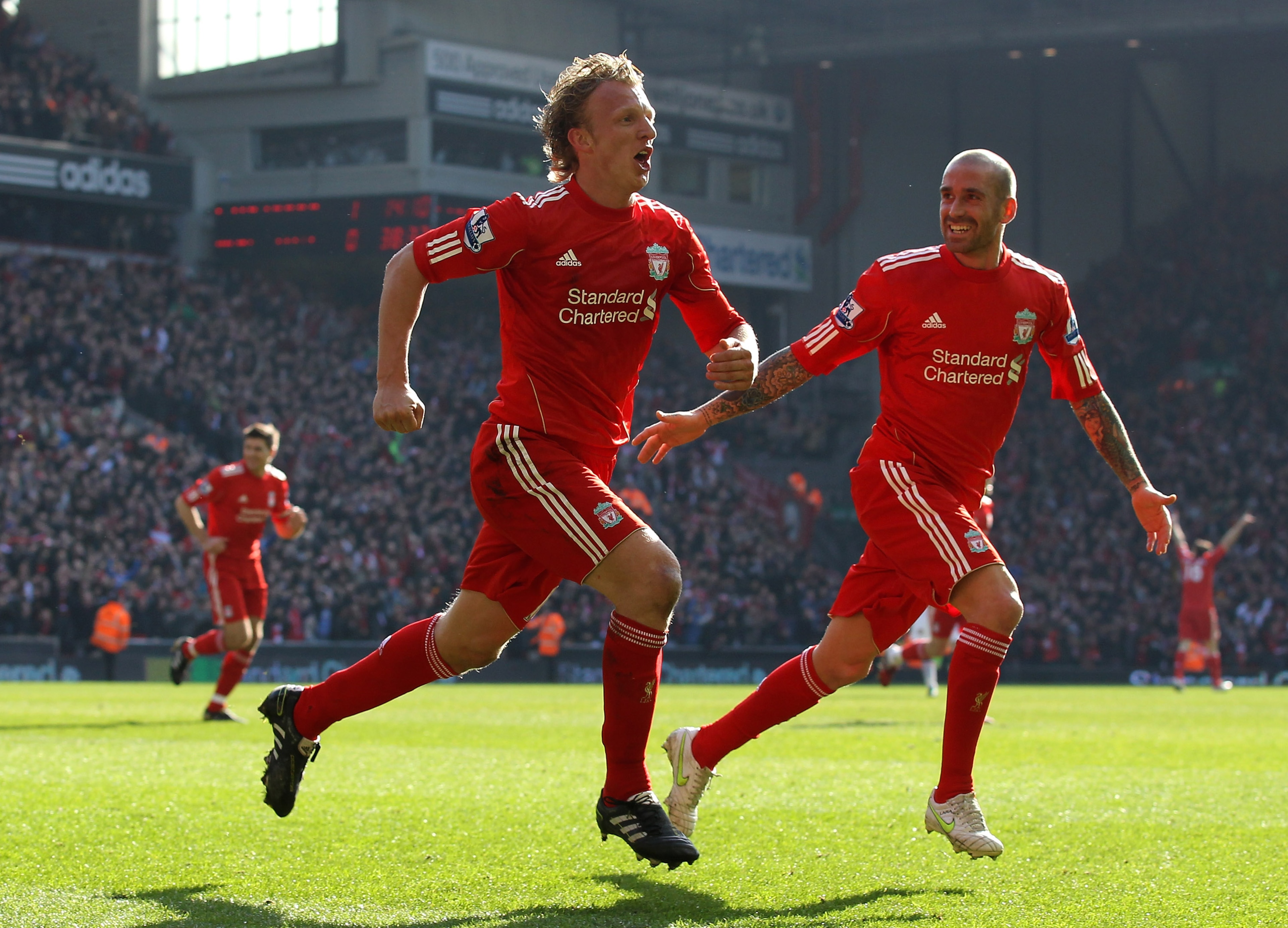 LIVERPOOL, ENGLAND - MARCH 06:  Dirk Kuyt of Liverpool celebrates scoring his team's second goal with team mate Raul Meireles (R) during the Barclays Premier League match between Liverpool and Manchester United at Anfield on March 6, 2011 in Liverpool, En