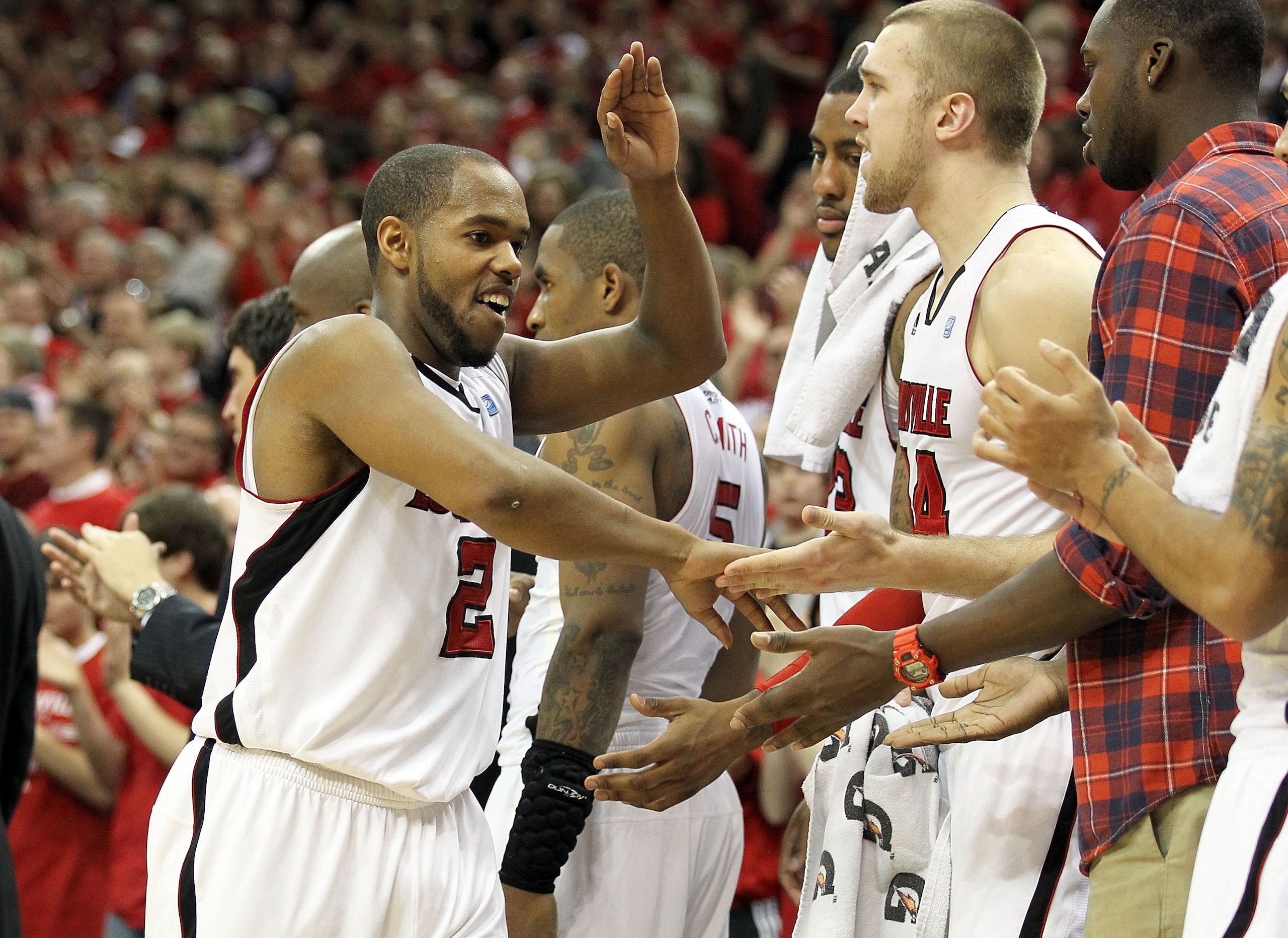 LOUISVILLE, KY - MARCH 02:  Preston Knowles #2 of the Louisville Cardinals celebrates in the final minute of the game  during the Big East Conference game against the Providence Friars at the KFC Yum! Center on March 2, 2011 in Louisville, Kentucky.  Loui