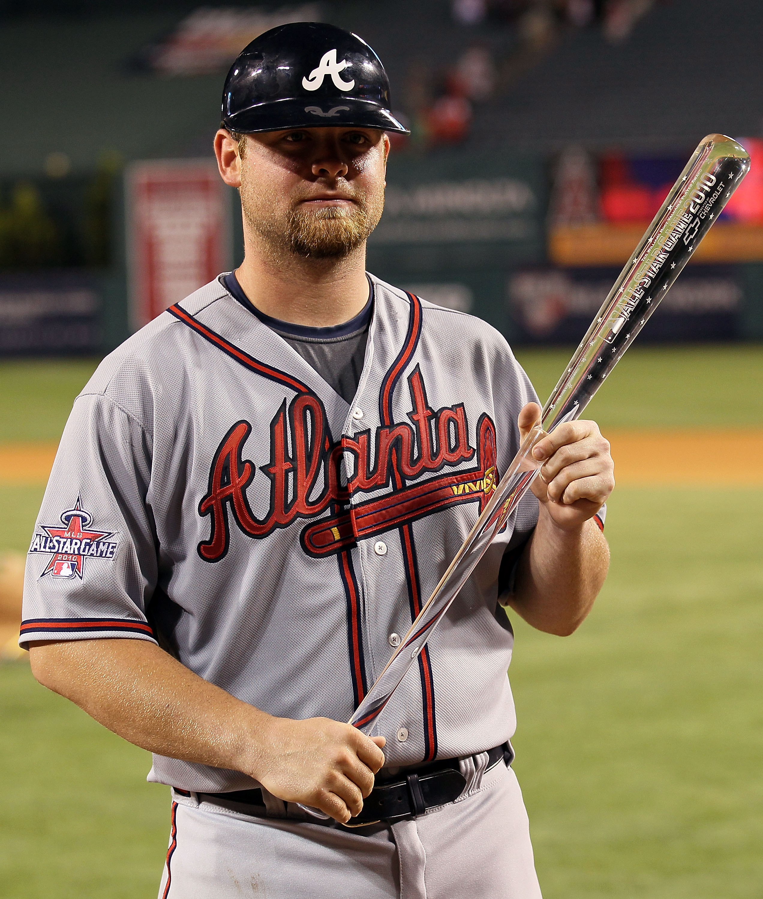 Former Atlanta Braves player Chipper Jones, left, presents the 2020  National League Most Valuable Player Award to Braves first baseman Freddie  Freeman before a baseball game against the Philadelphia Phillies, Sunday,  April